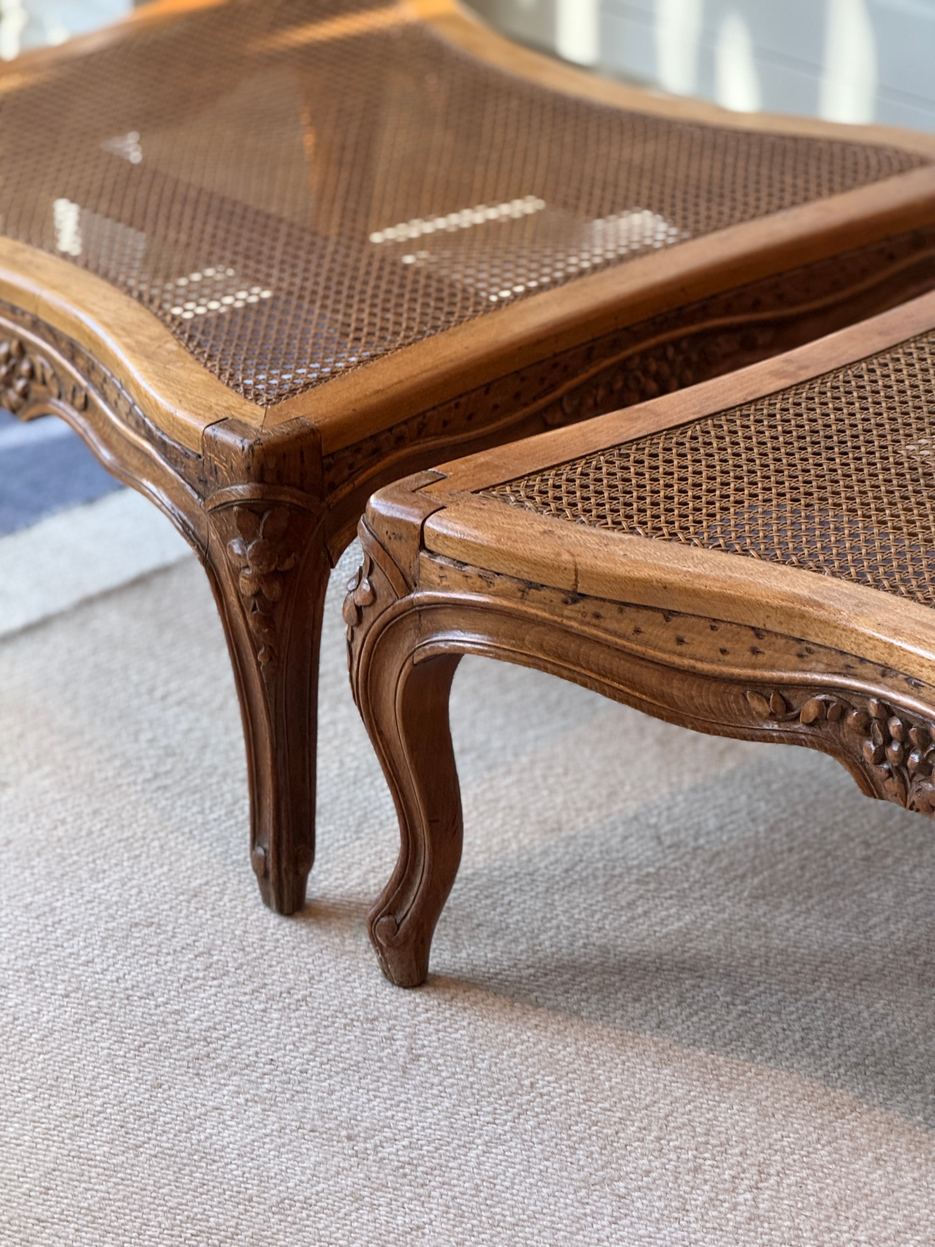 Pair of low French fruitwood and cane coffee table