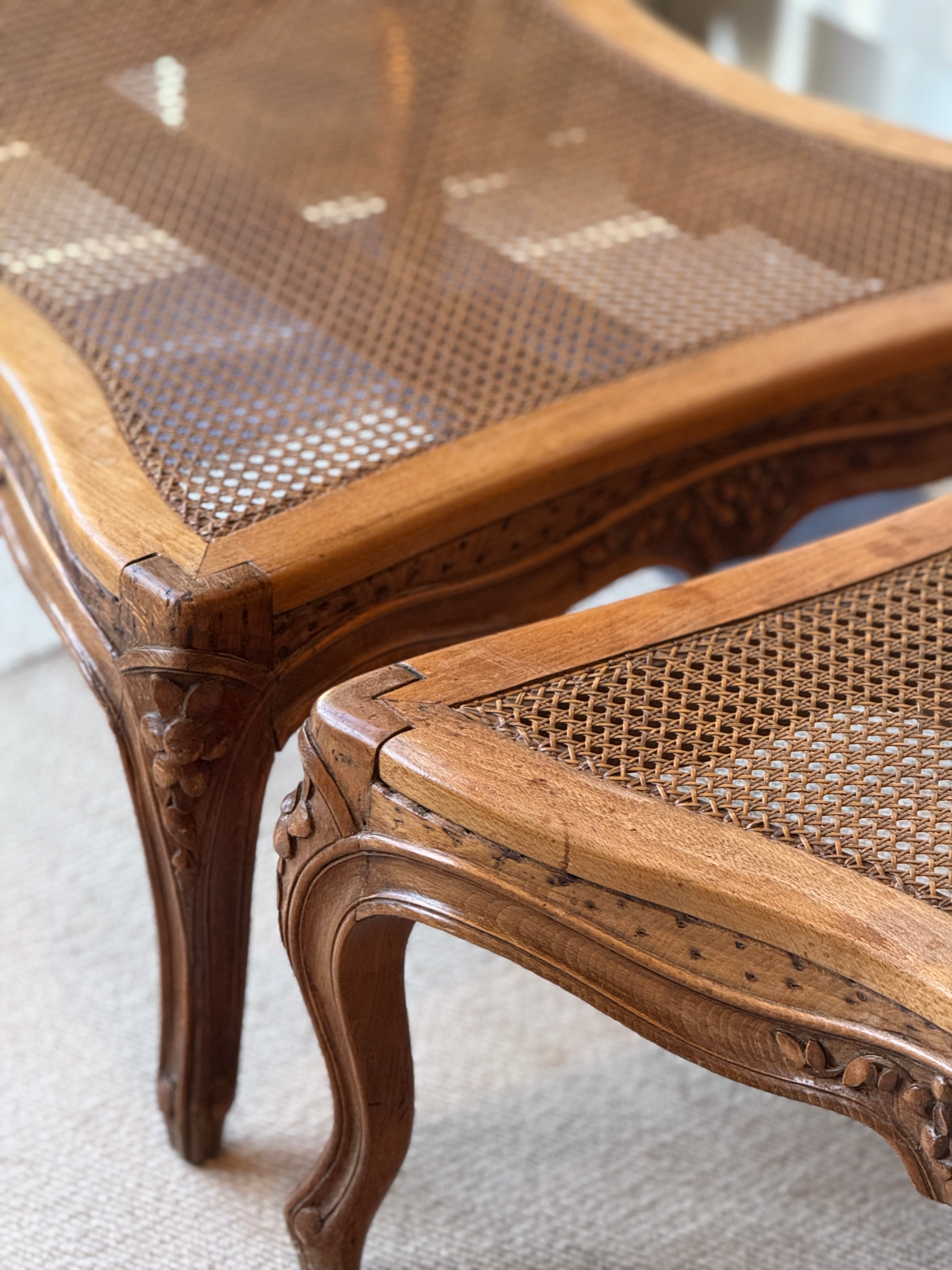 Pair of low French fruitwood and cane coffee table