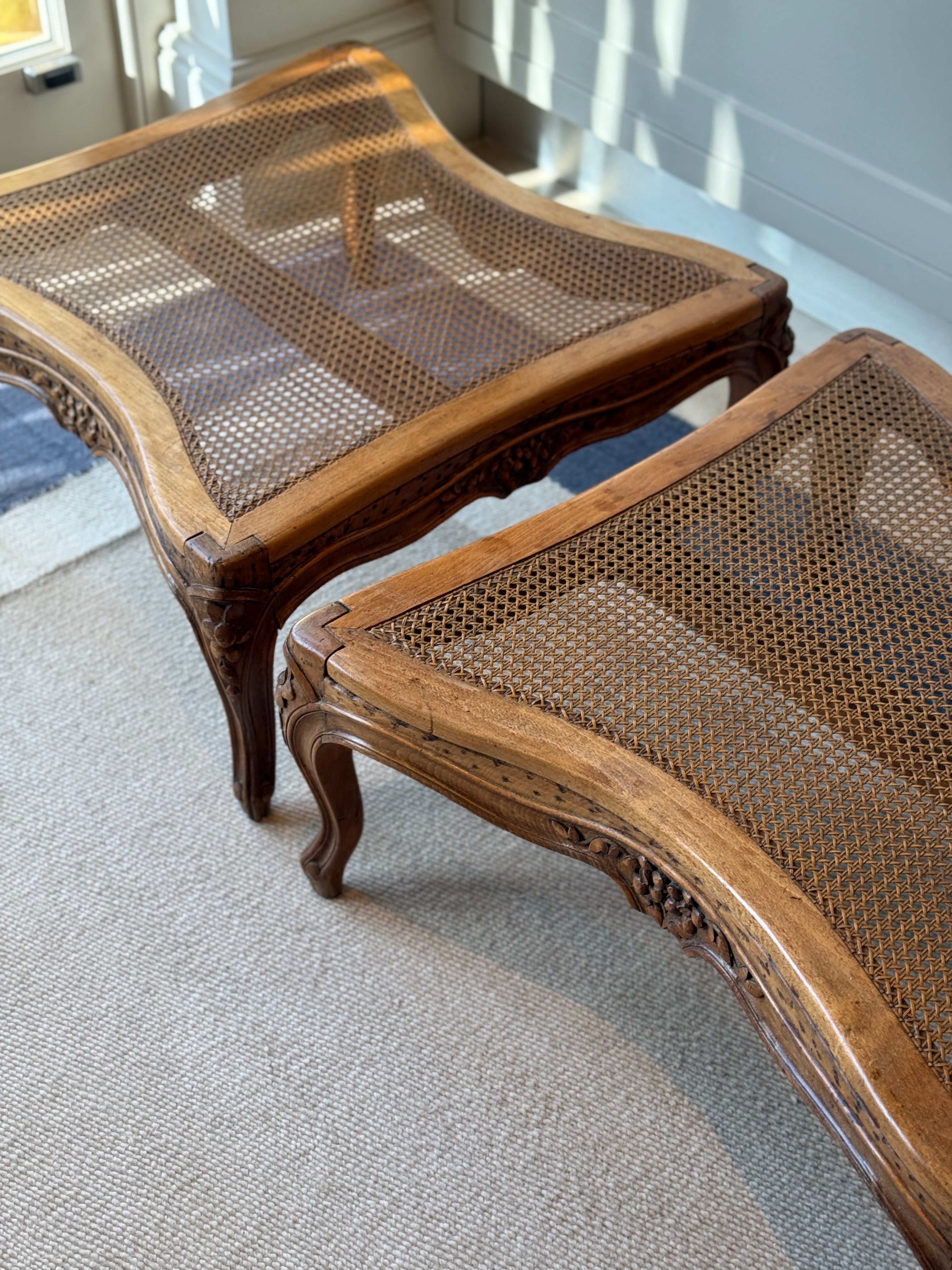 Pair of low French fruitwood and cane coffee table