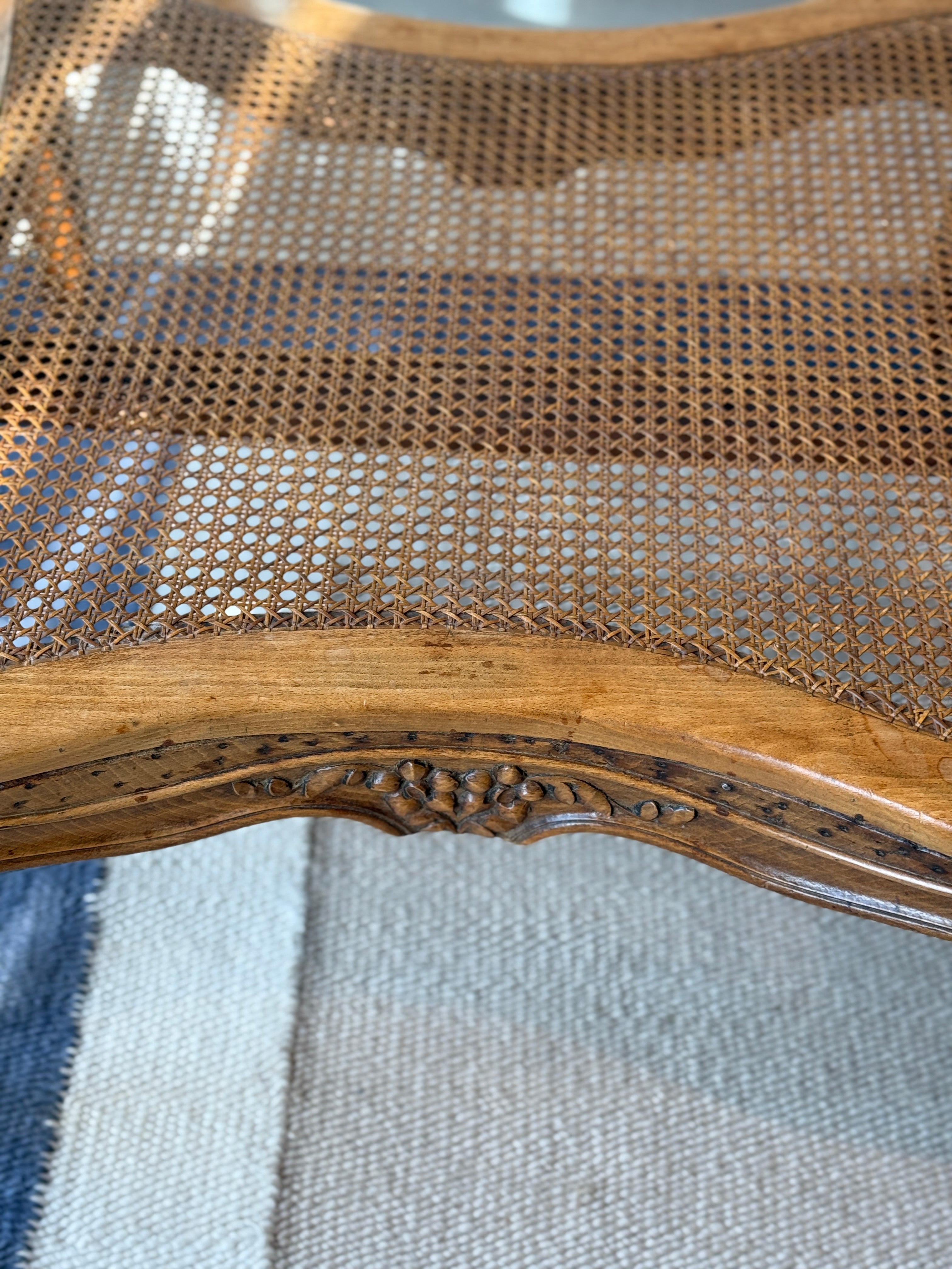 Pair of low French fruitwood and cane coffee table