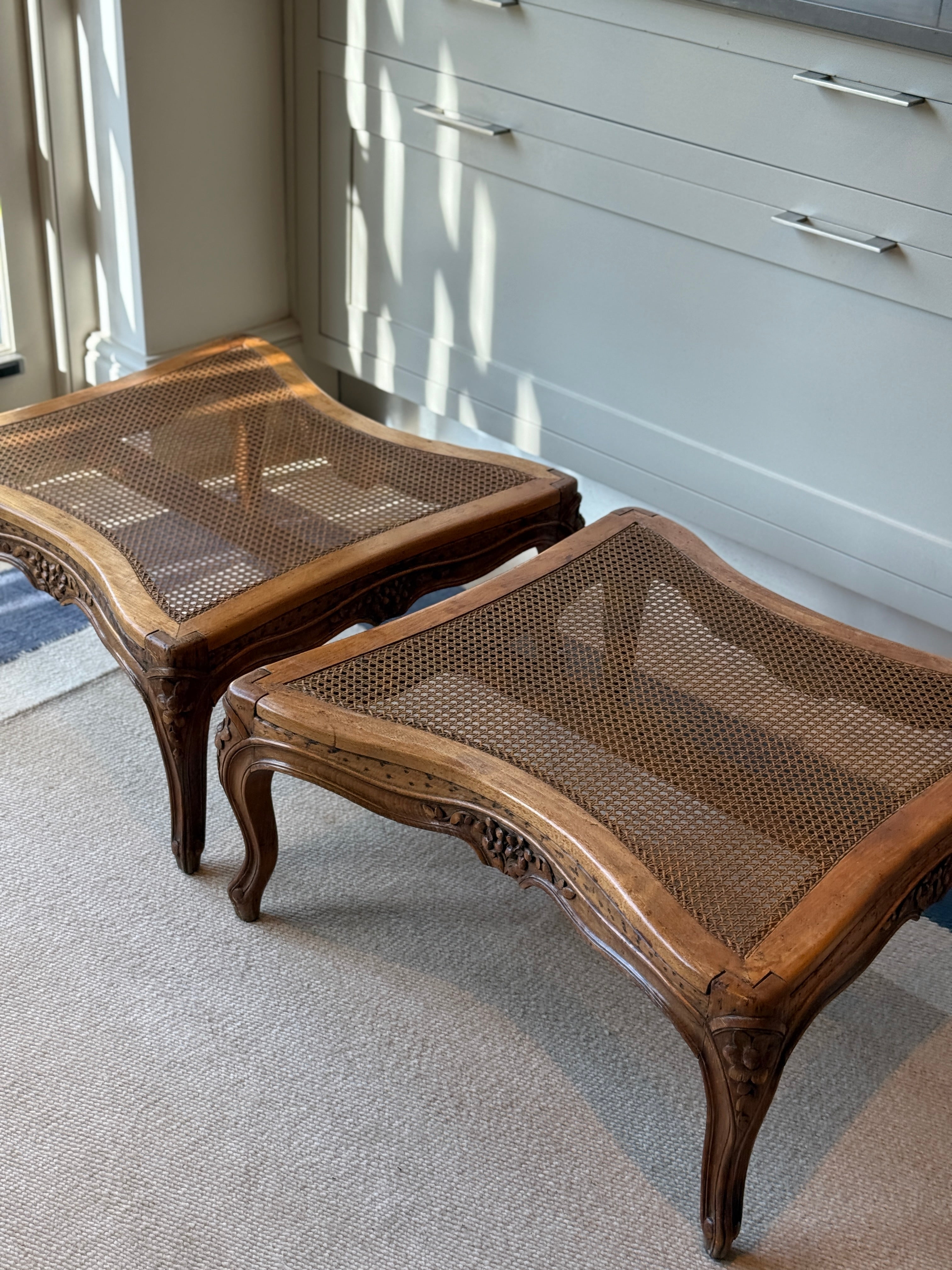 Pair of low French fruitwood and cane coffee table