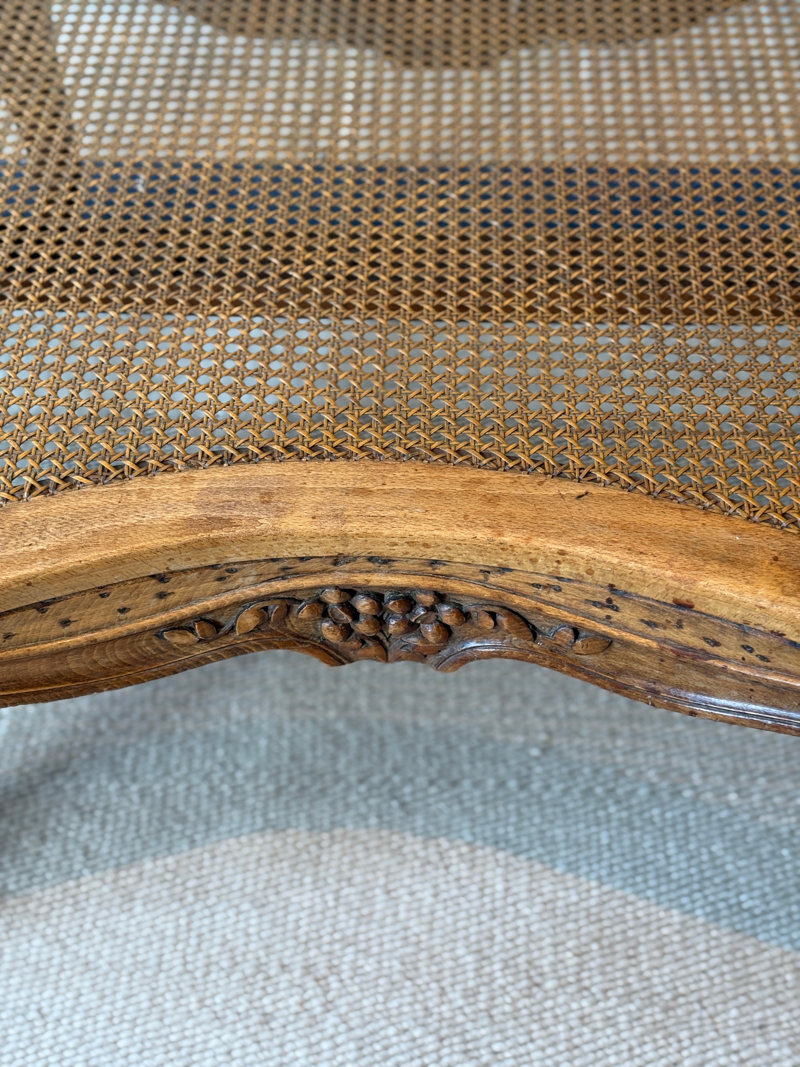 Pair of low French fruitwood and cane coffee table