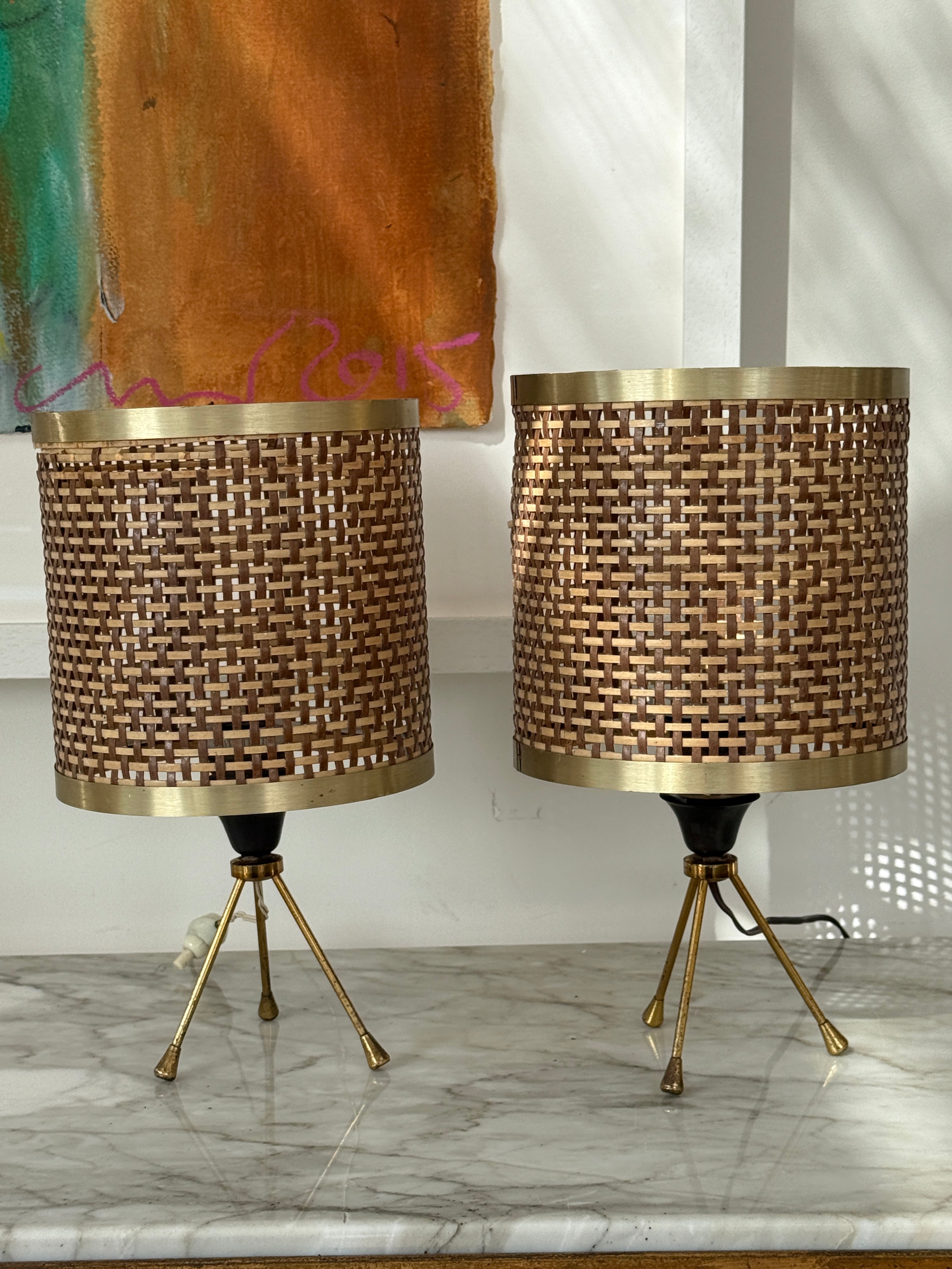 Pair of Rattan and Brass Tripod Taboe Lamps .
