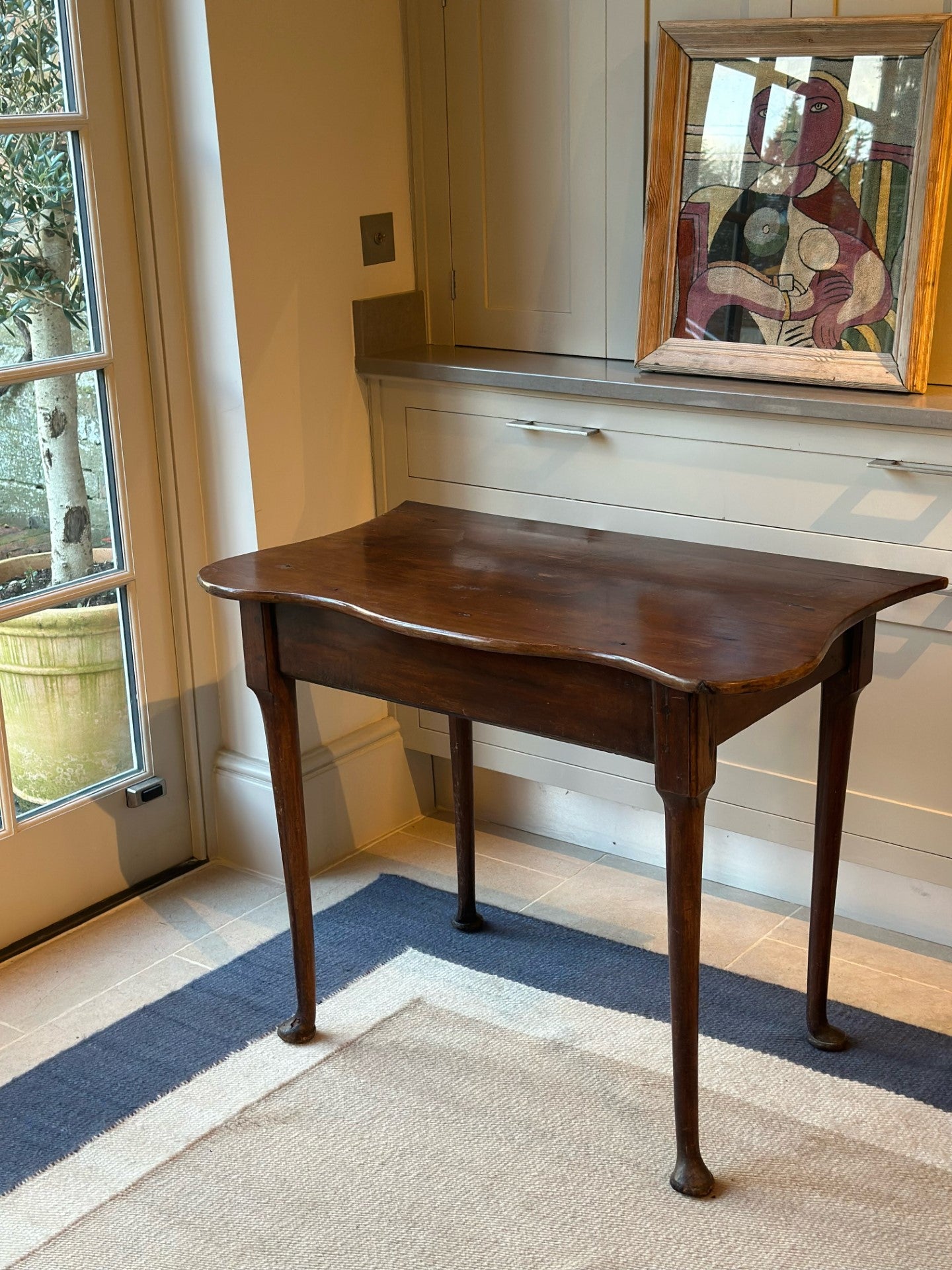 Serpentine Regency Mahogany Pad Foot Table