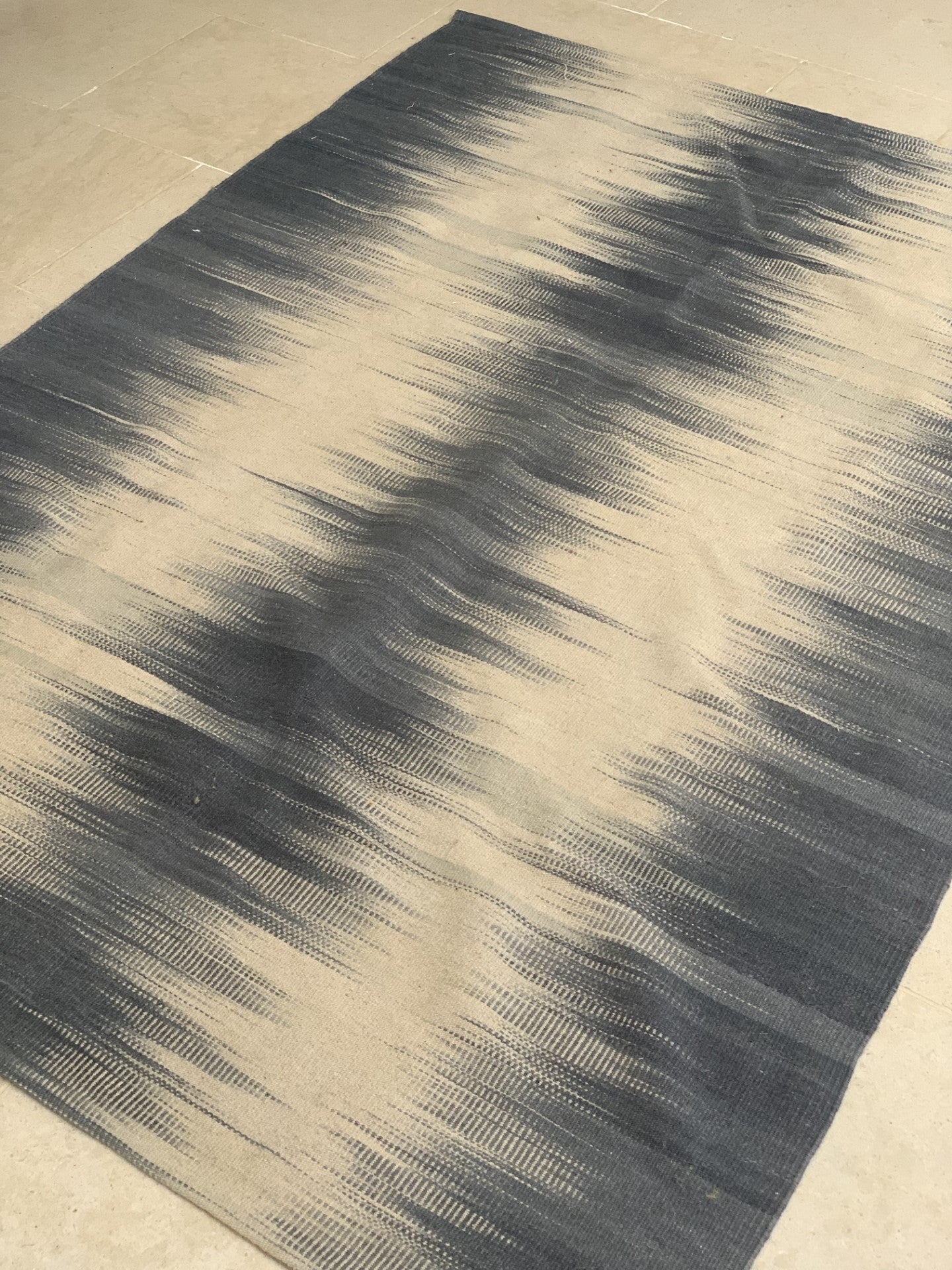 Pale blue Rug with Symmetrical Patterns