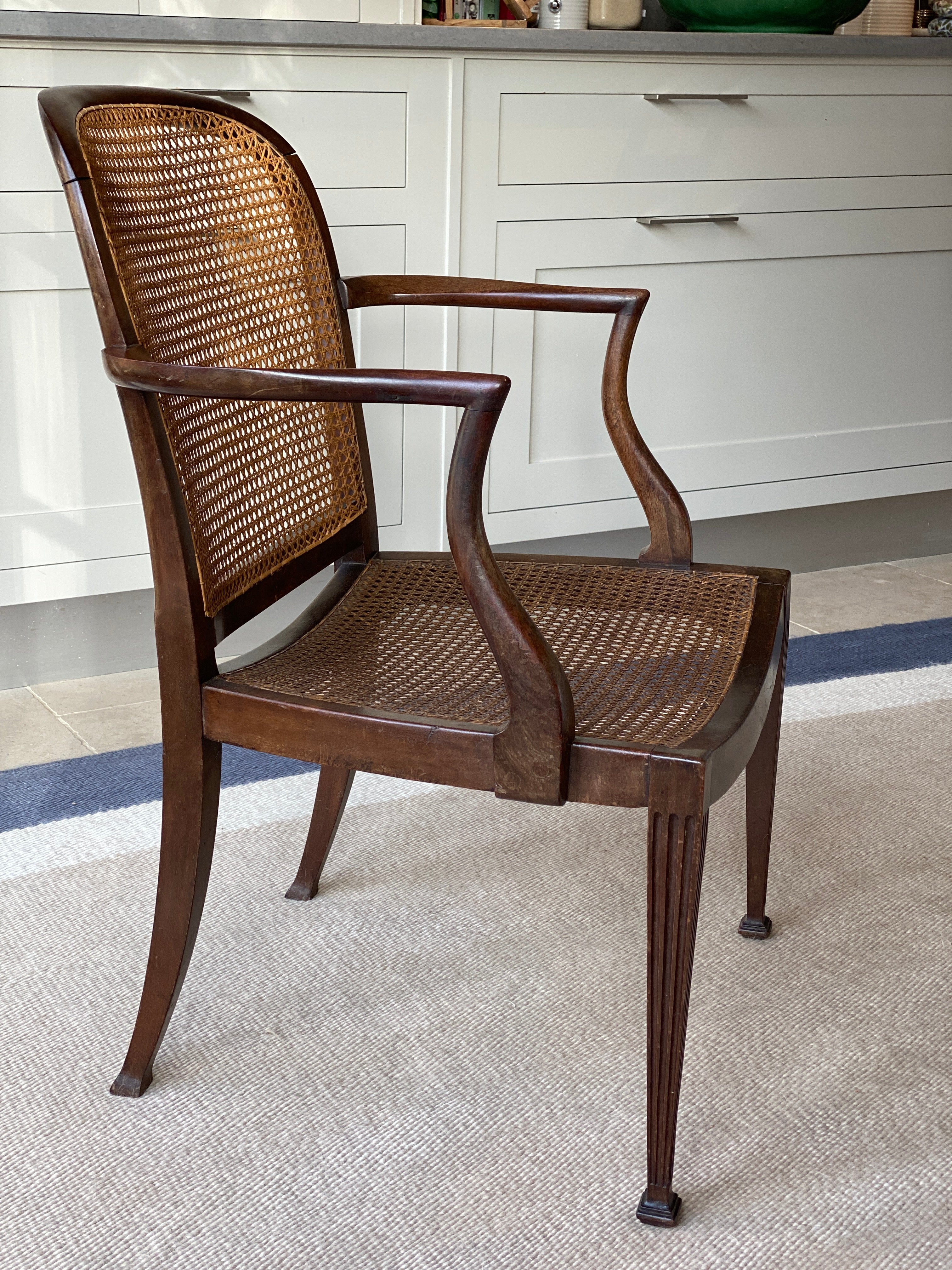 Large walnut and cane arm chair