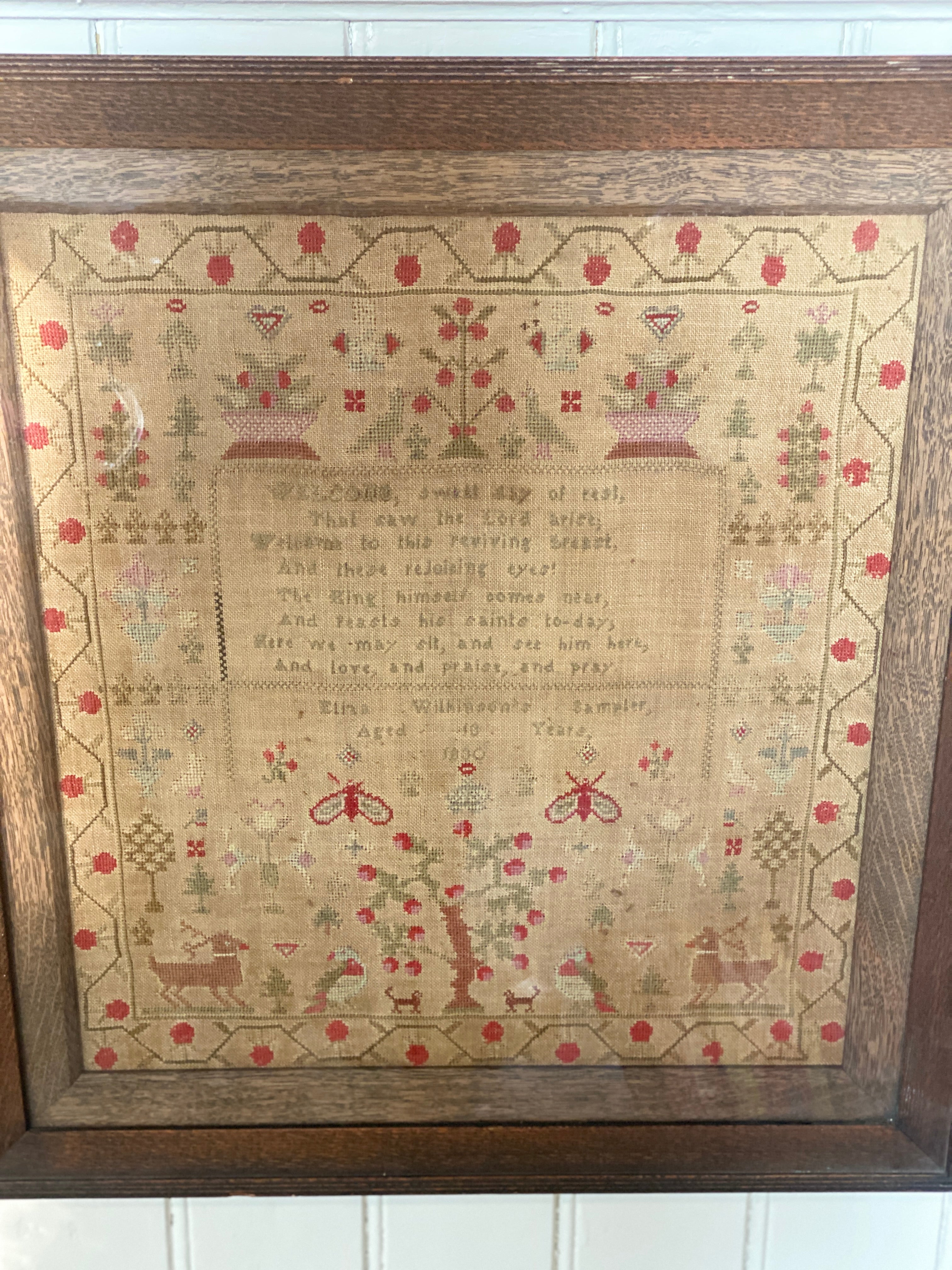 A framed George IV needlework sampler