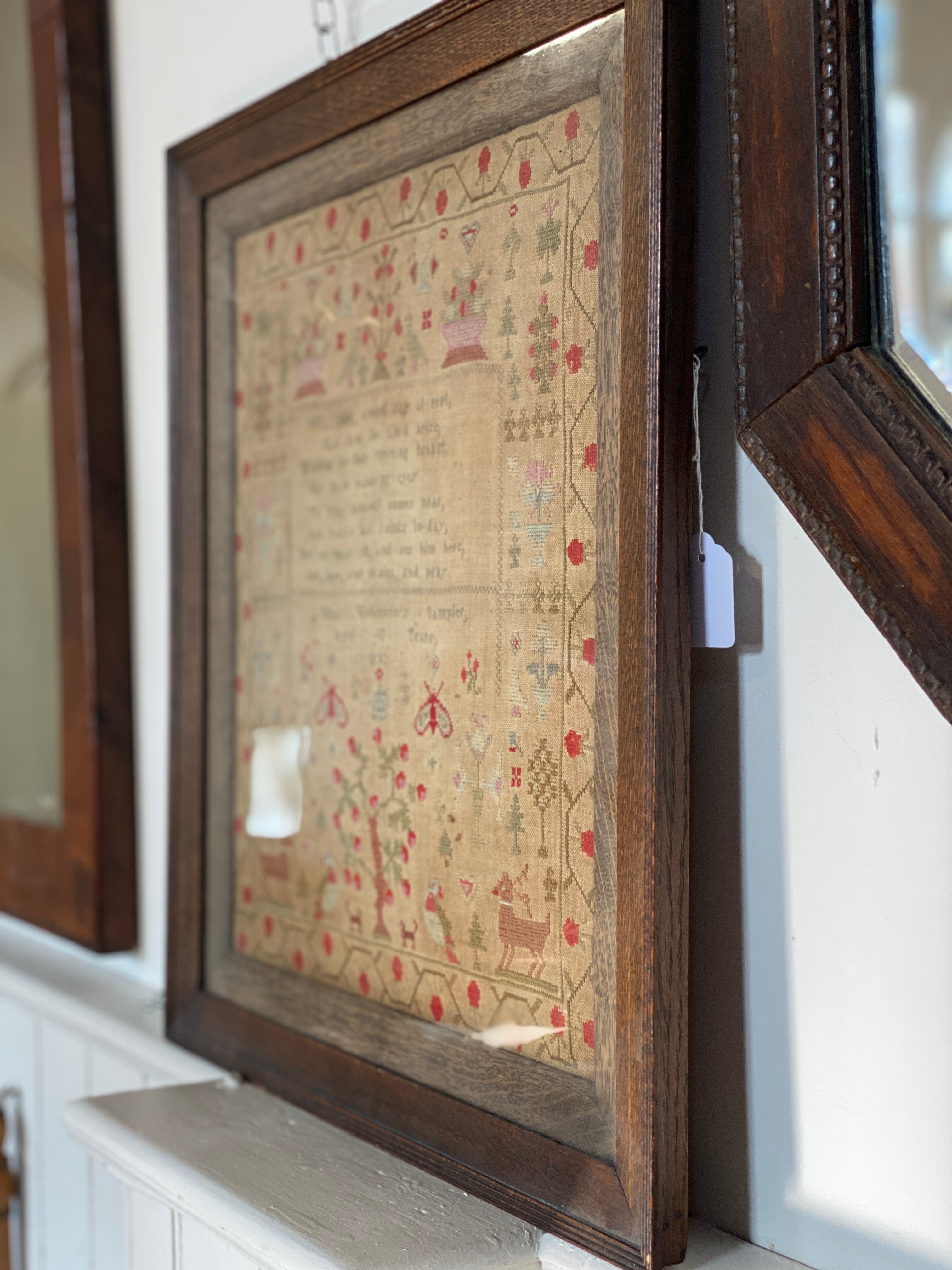 A framed George IV needlework sampler