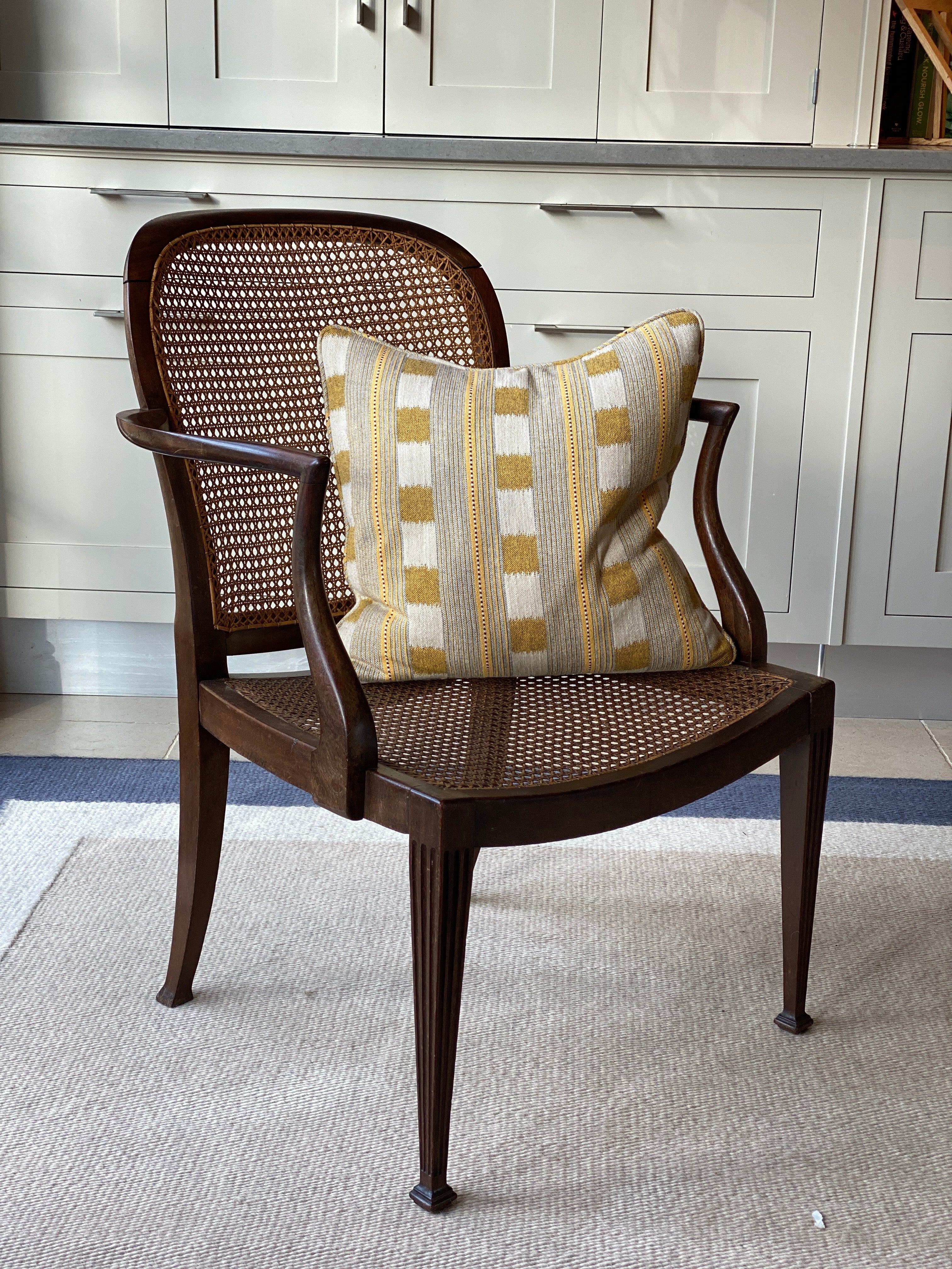 Large walnut and cane arm chair