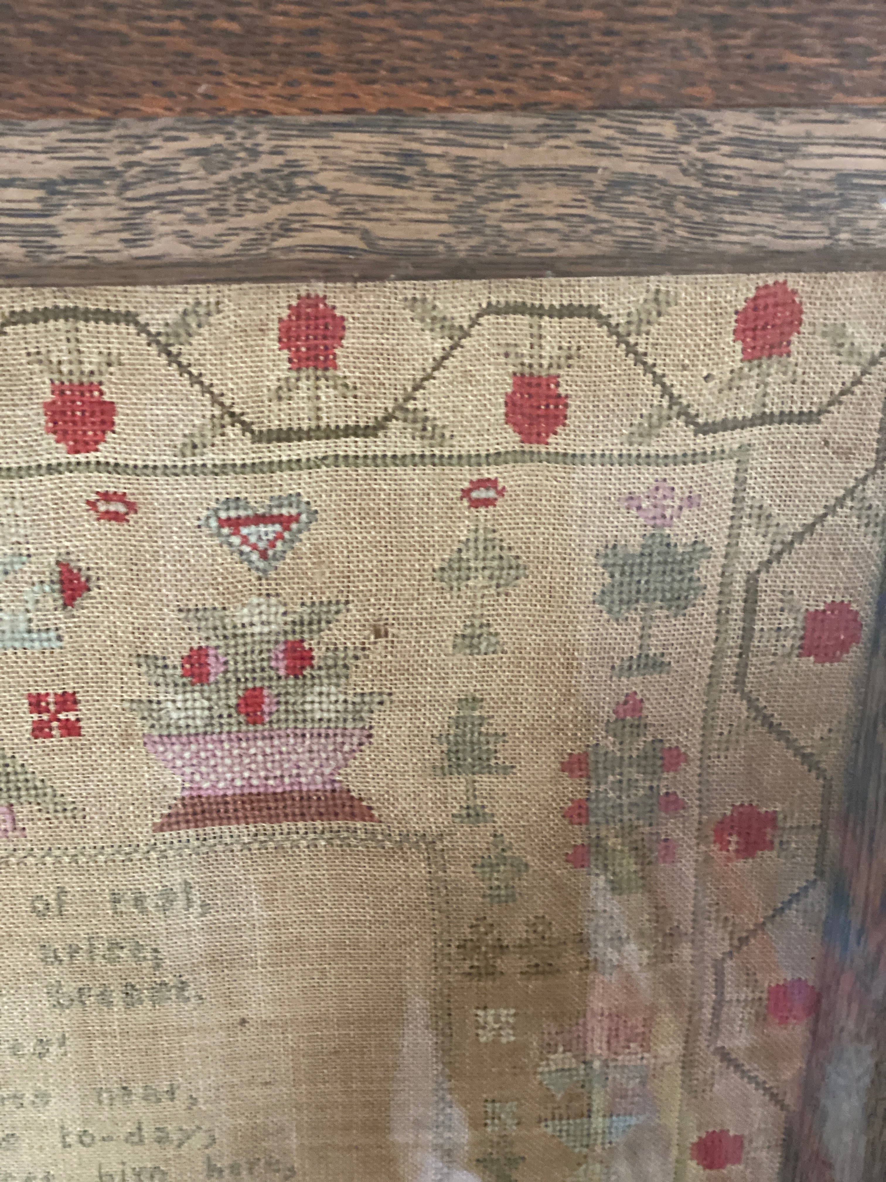 A framed George IV needlework sampler