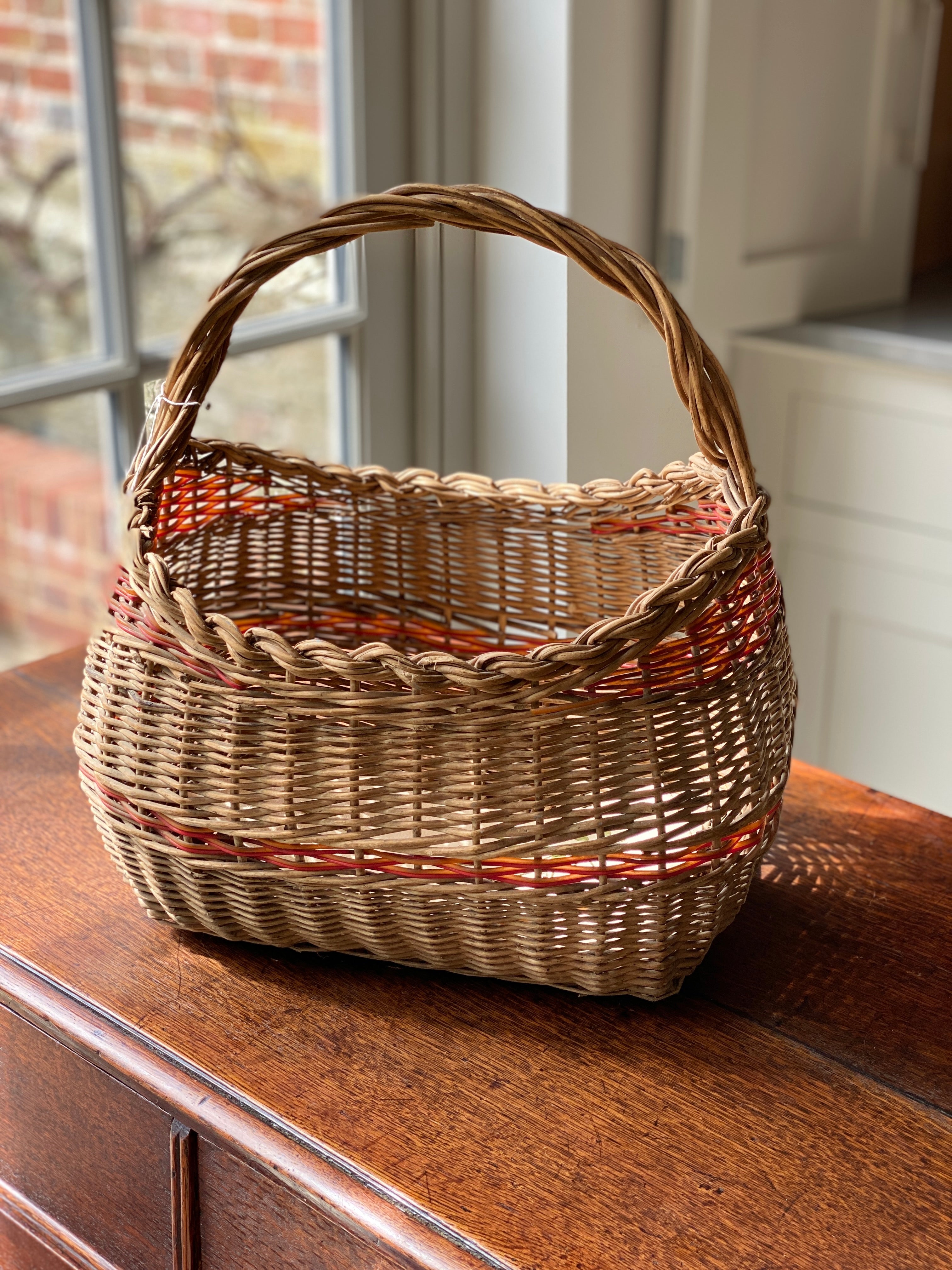 Vintage French wicker basket with red striping