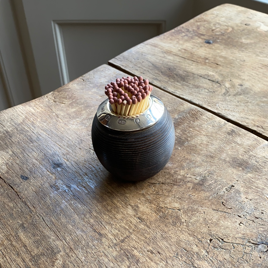 Wooden and silver match striker