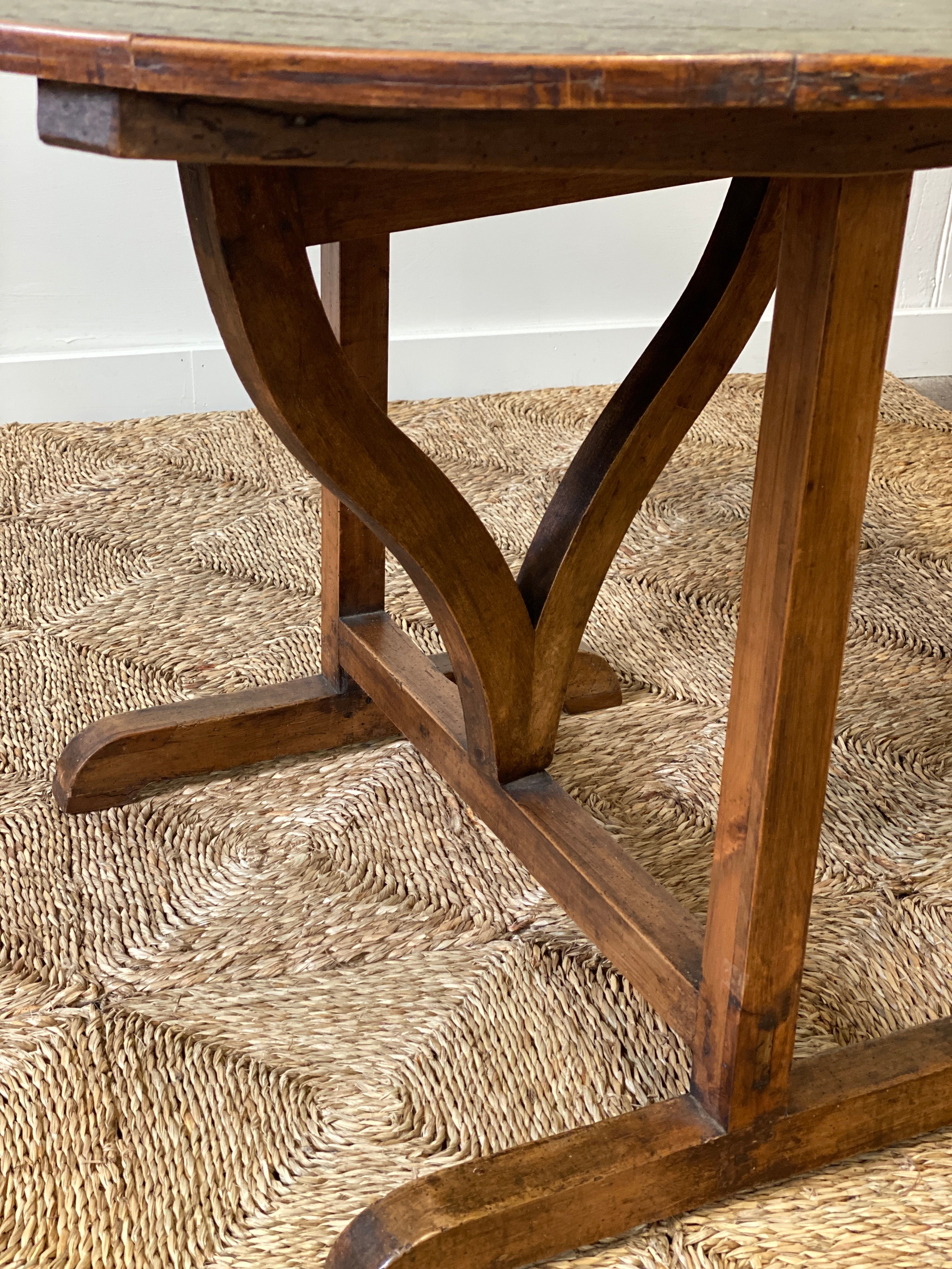 Early C20th French vendange wine table with green leather top.