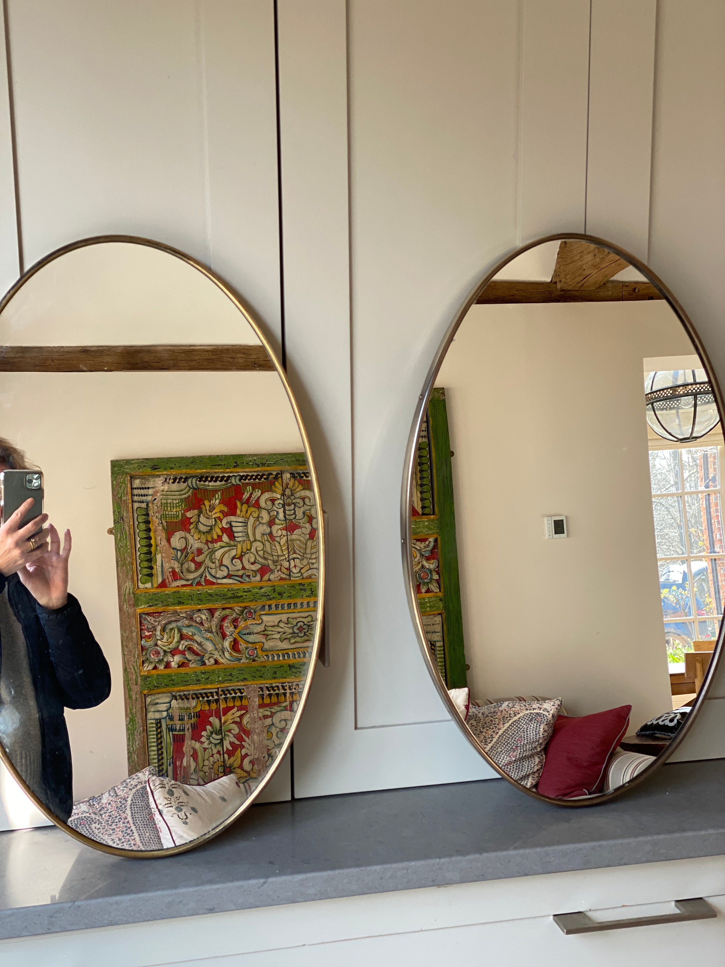 Lovely Mid-Century Pair of Oval Brass Mirrors