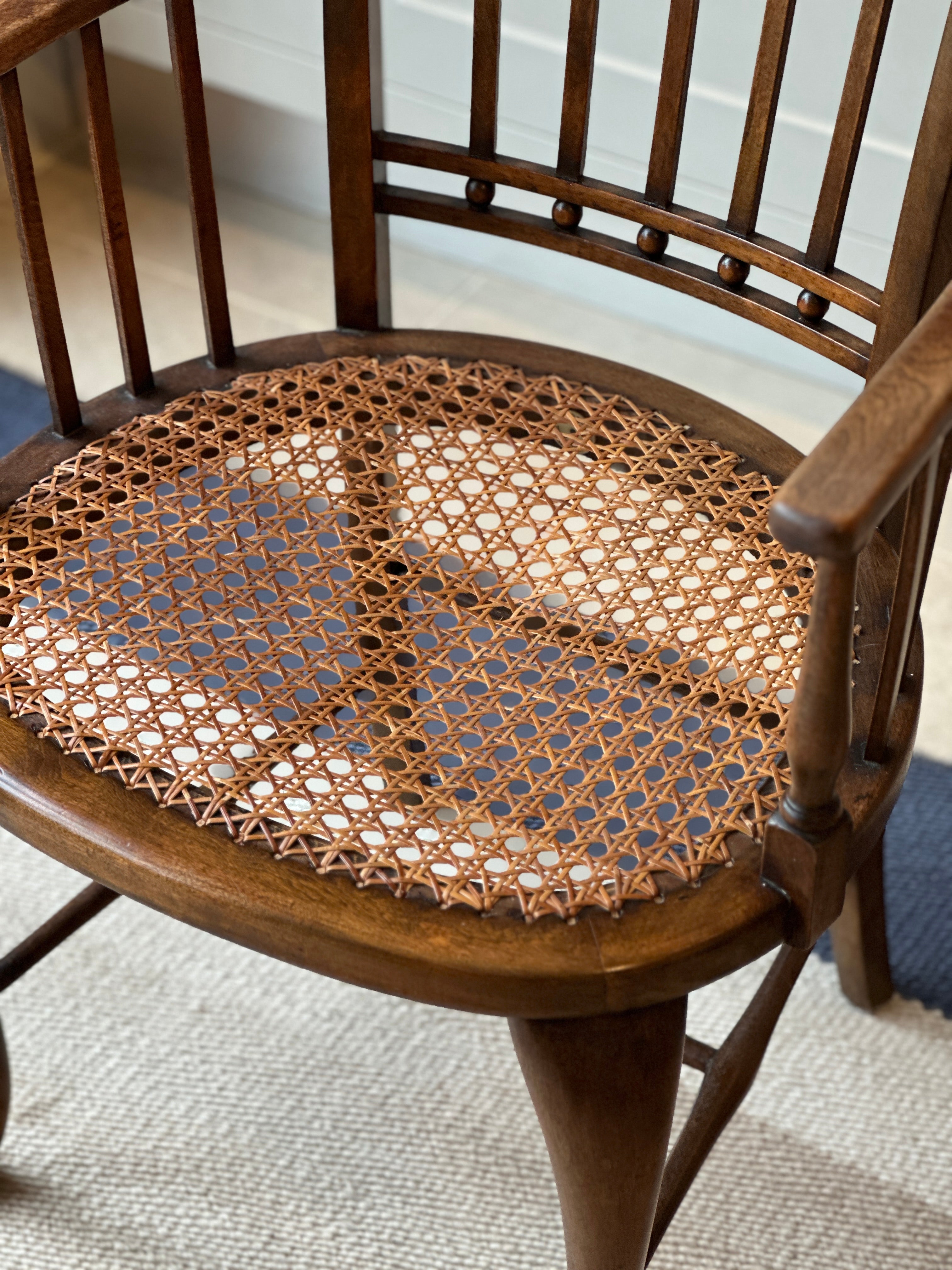 A Small Vintage JAS Shoolbred & Co Spindle Chair with Cane