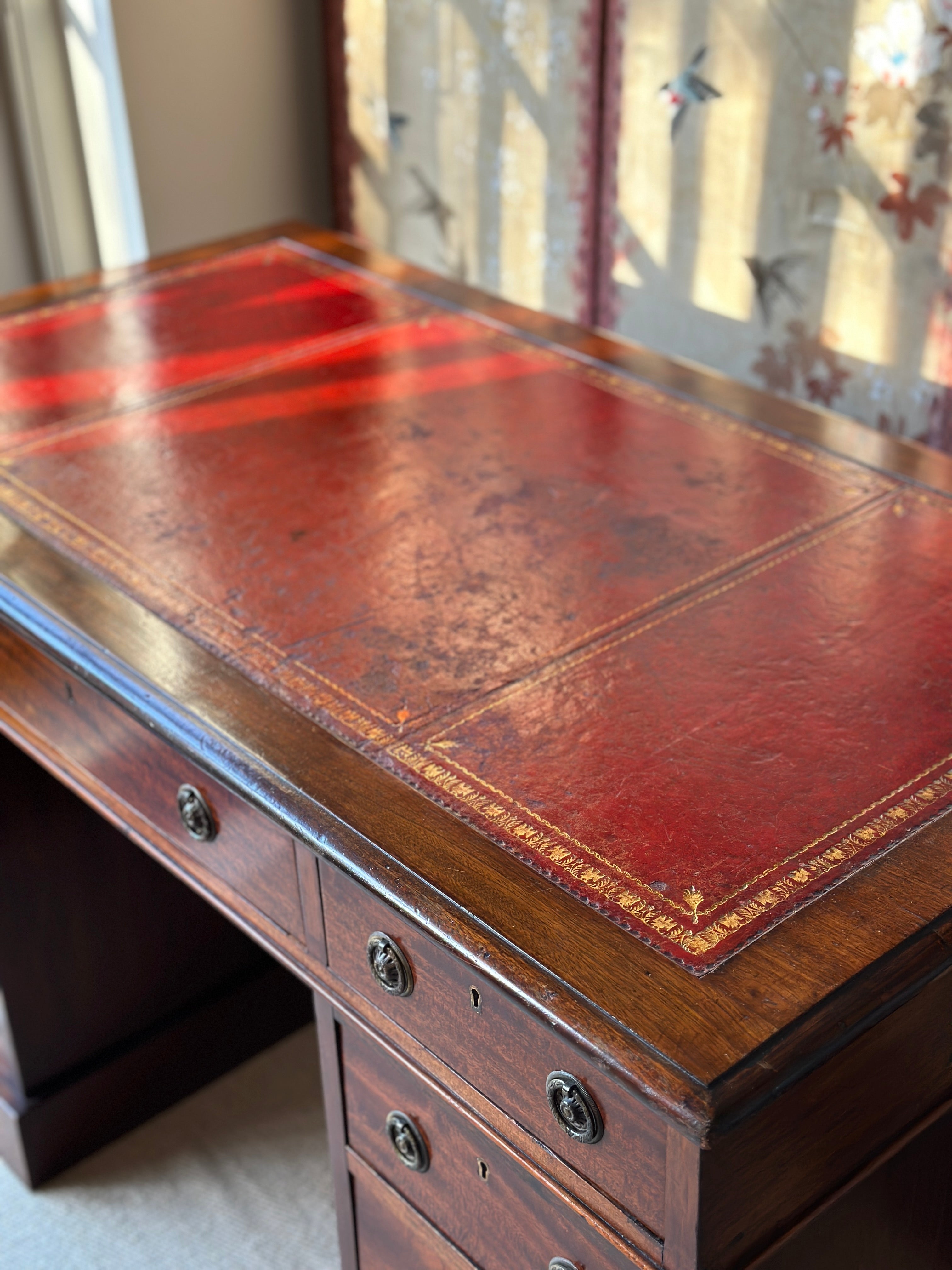 Amazing 19th Century Mahogany Desk with well worn Red Leather Top