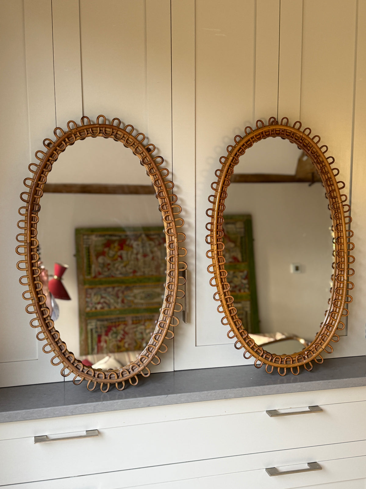 Pair of Large Oval Albini Mirrors
