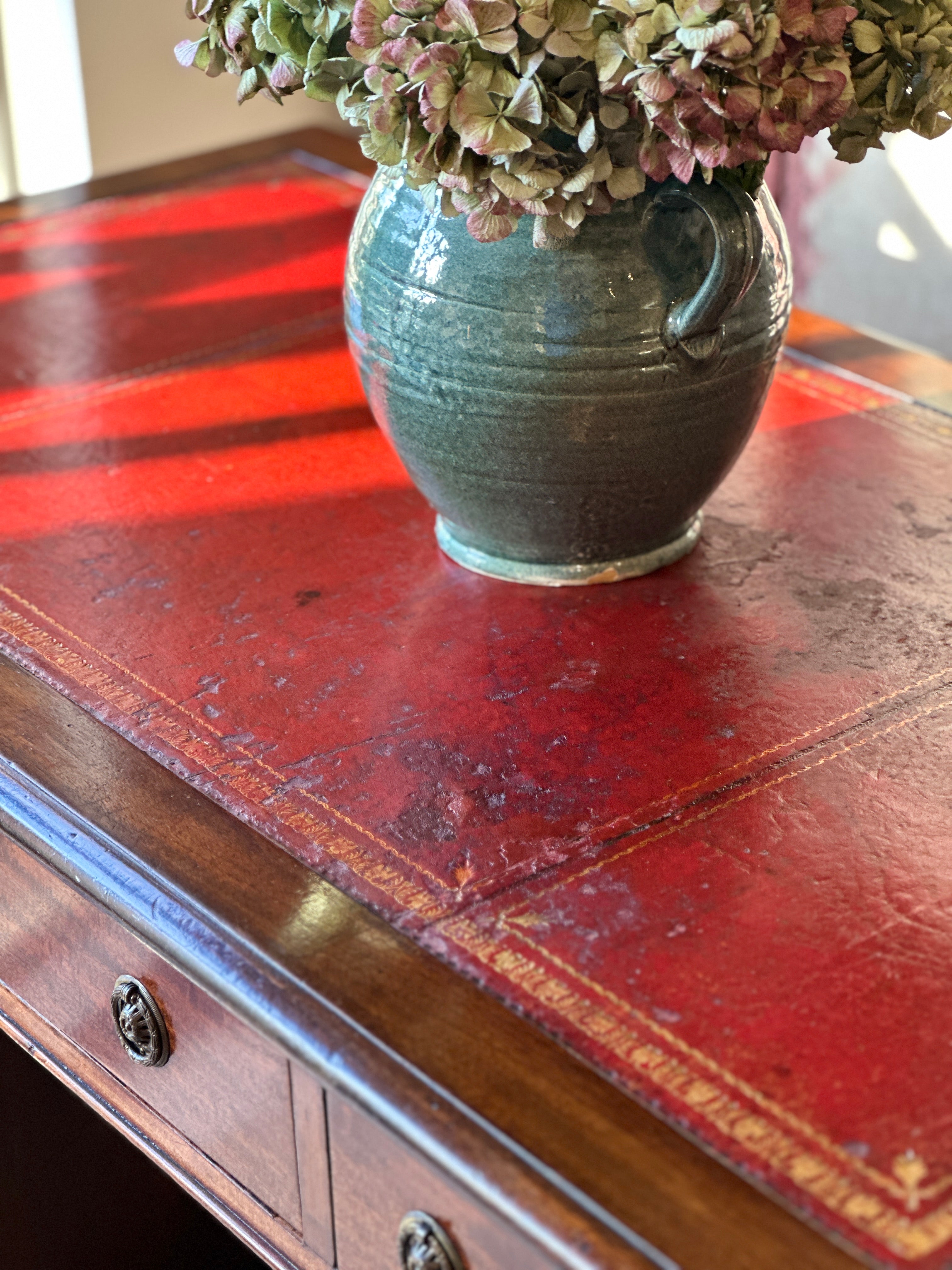 Amazing 19th Century Mahogany Desk with well worn Red Leather Top