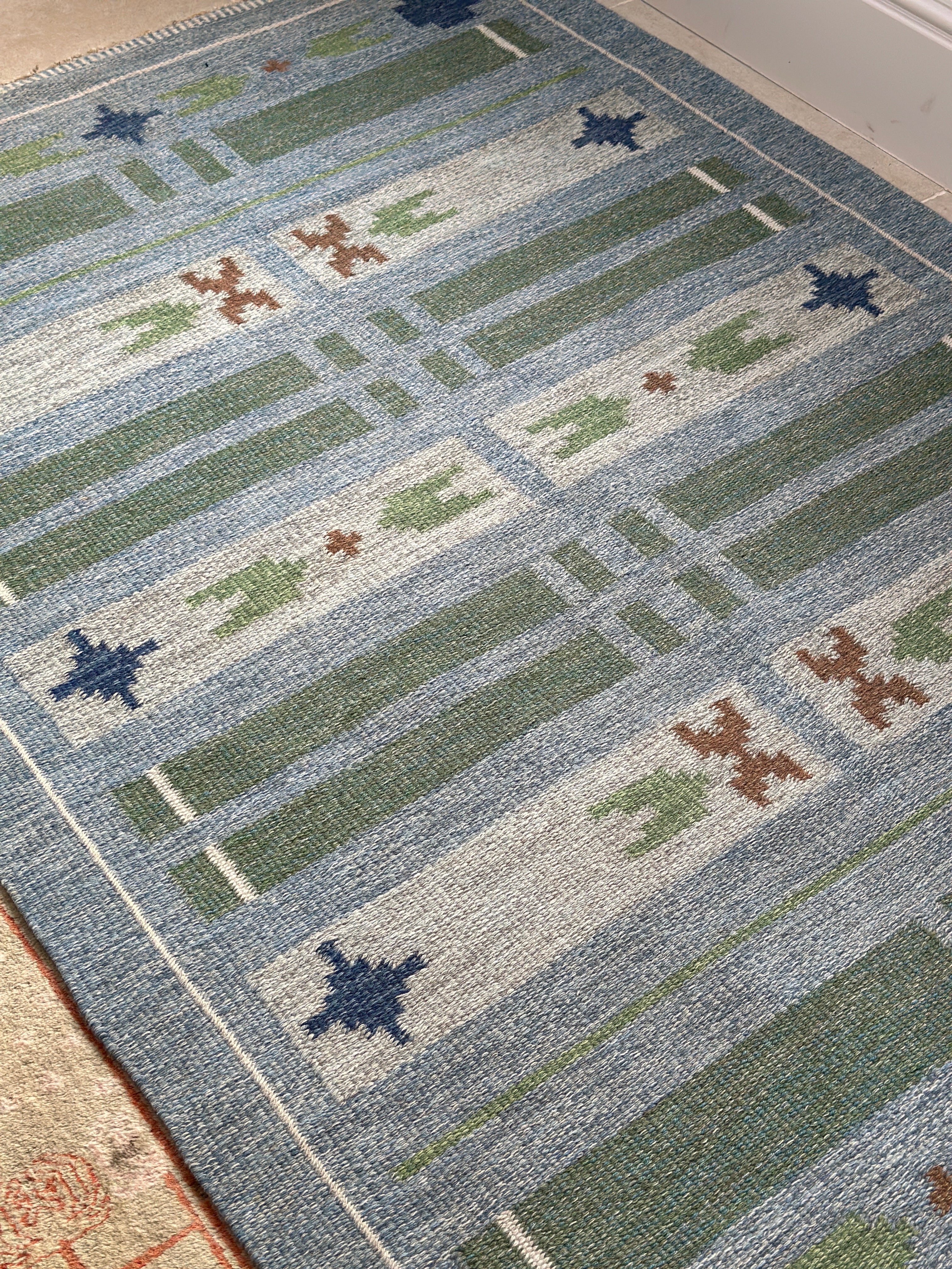 Swedish vintage kilim in blues and greens.