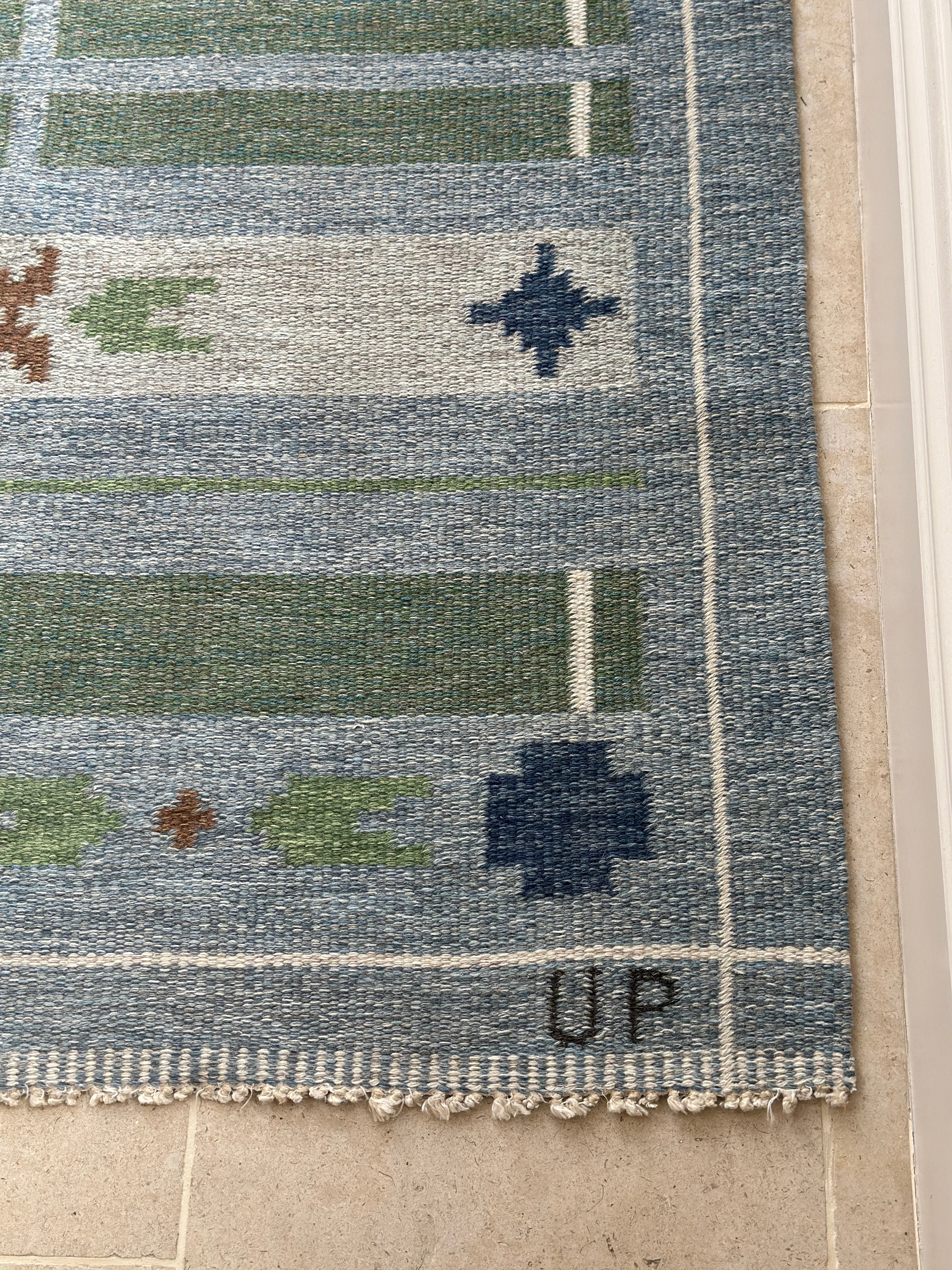 Swedish vintage kilim in blues and greens.