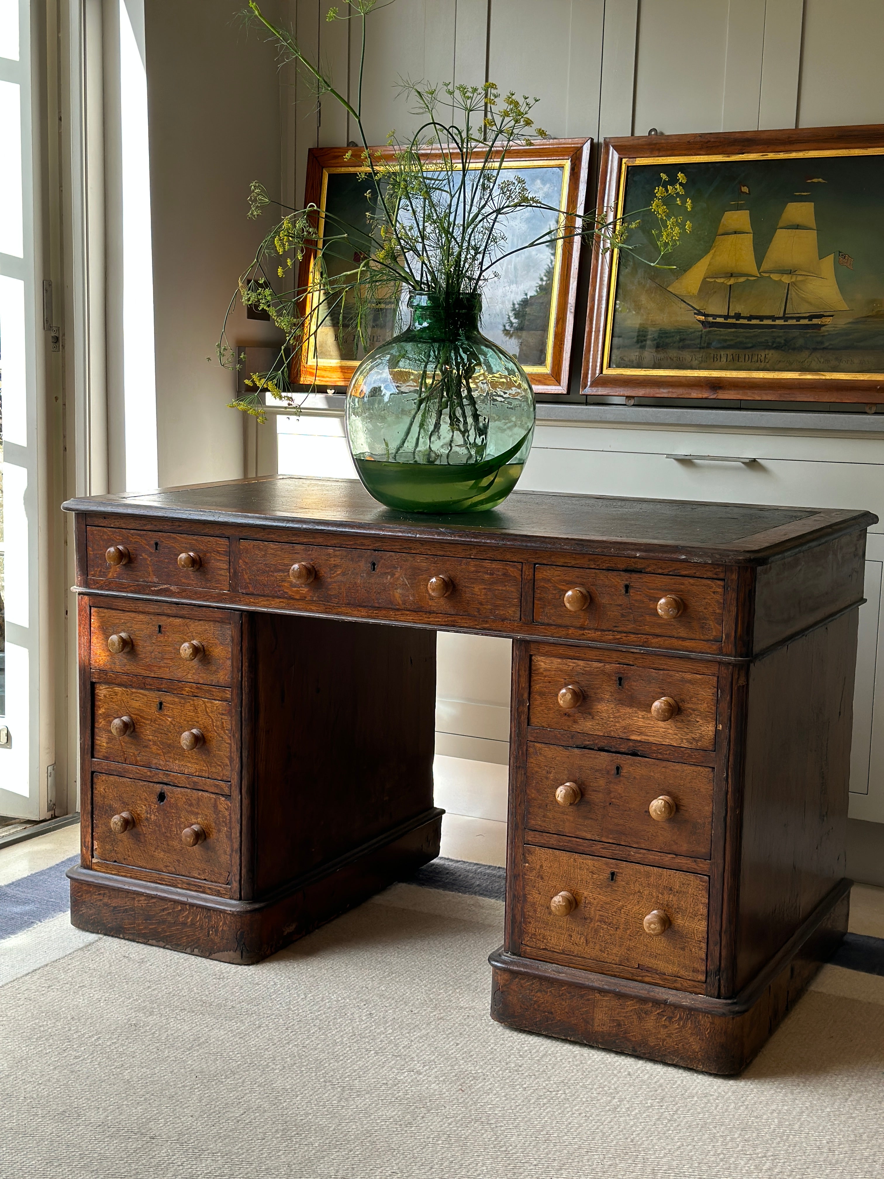 Antique Oak Desk with leather top on castors