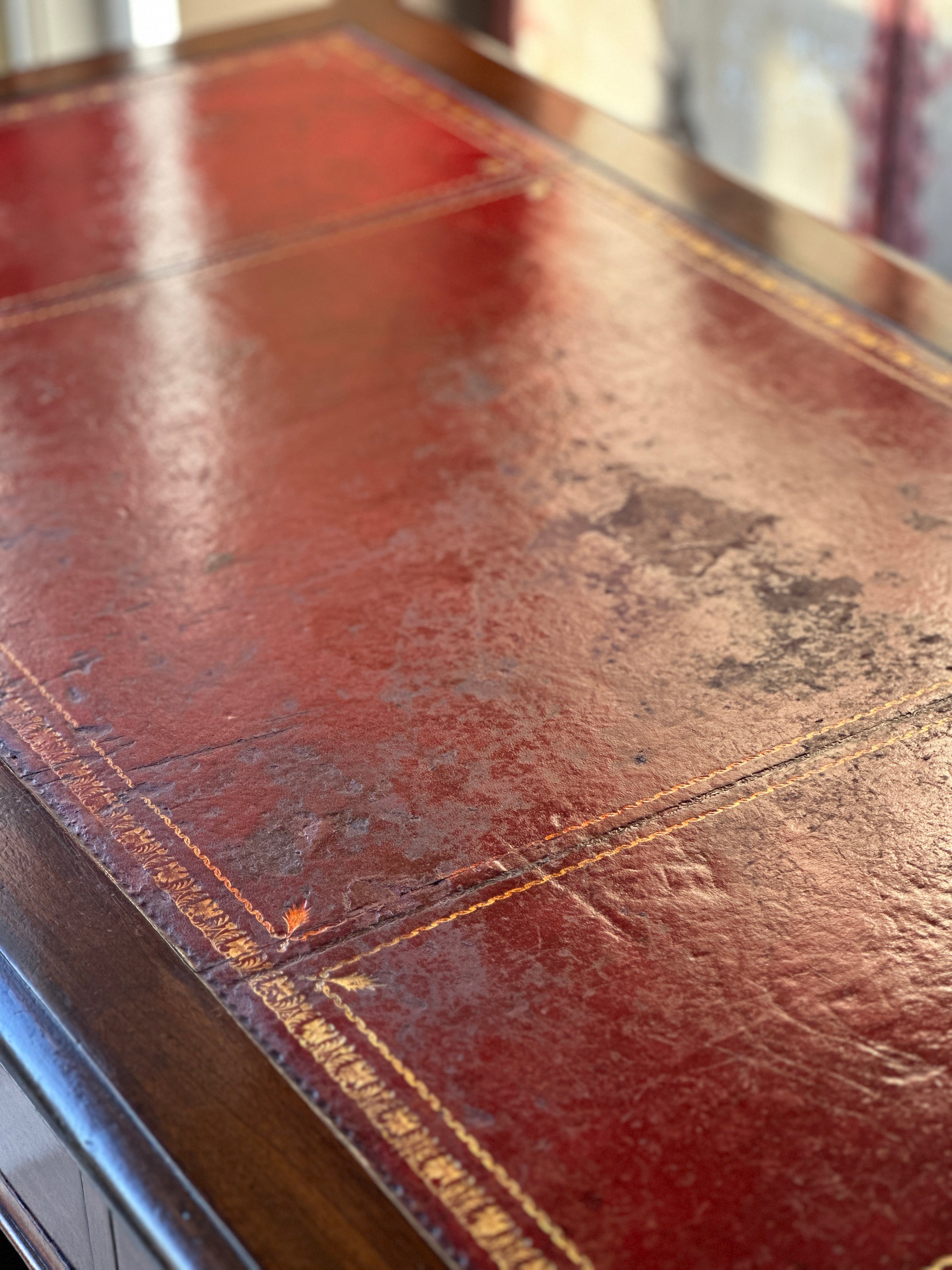 Amazing 19th Century Mahogany Desk with well worn Red Leather Top