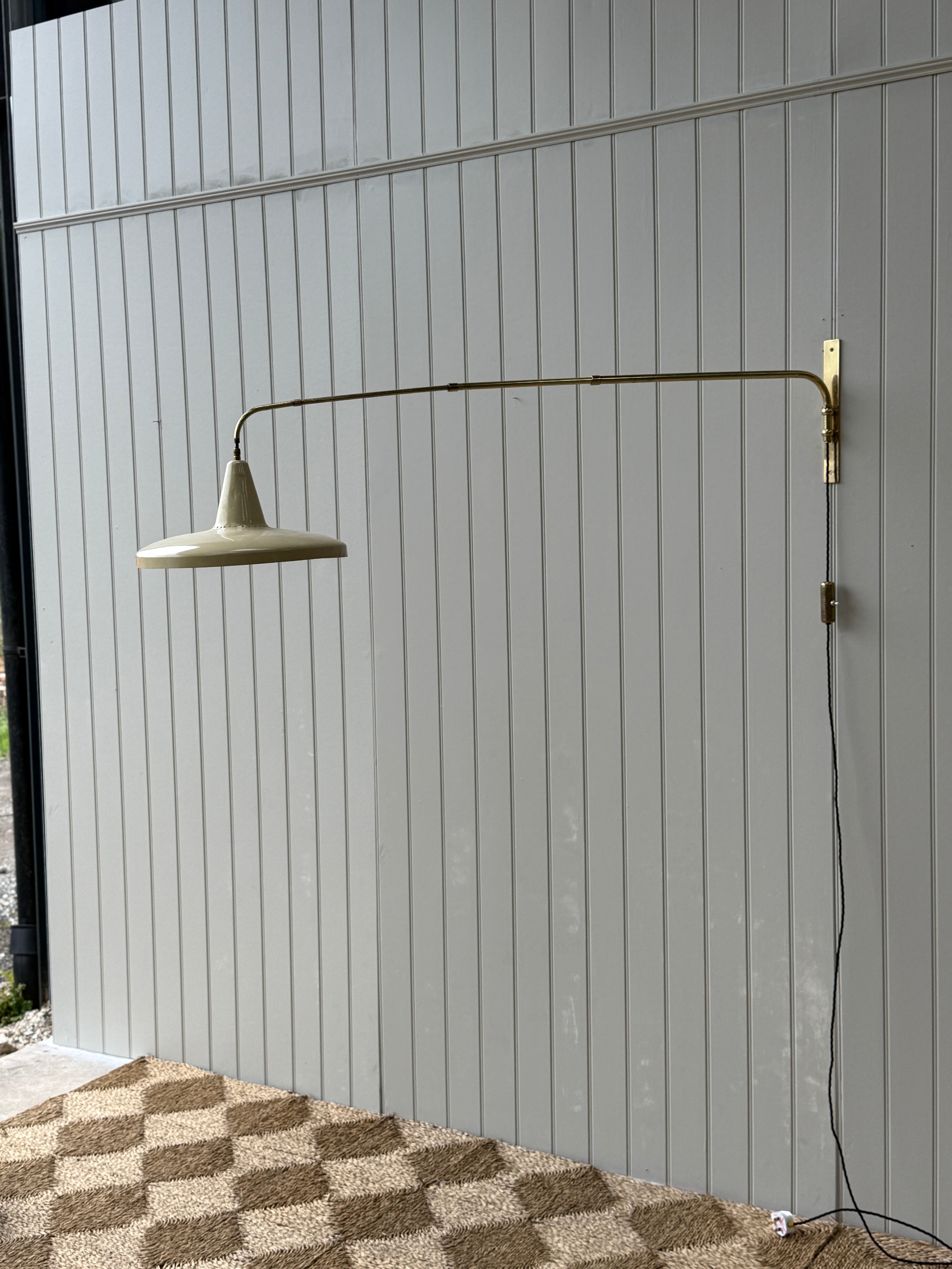 Italian 1950s Extending Brass Wall light with Yellow Toleware shade.