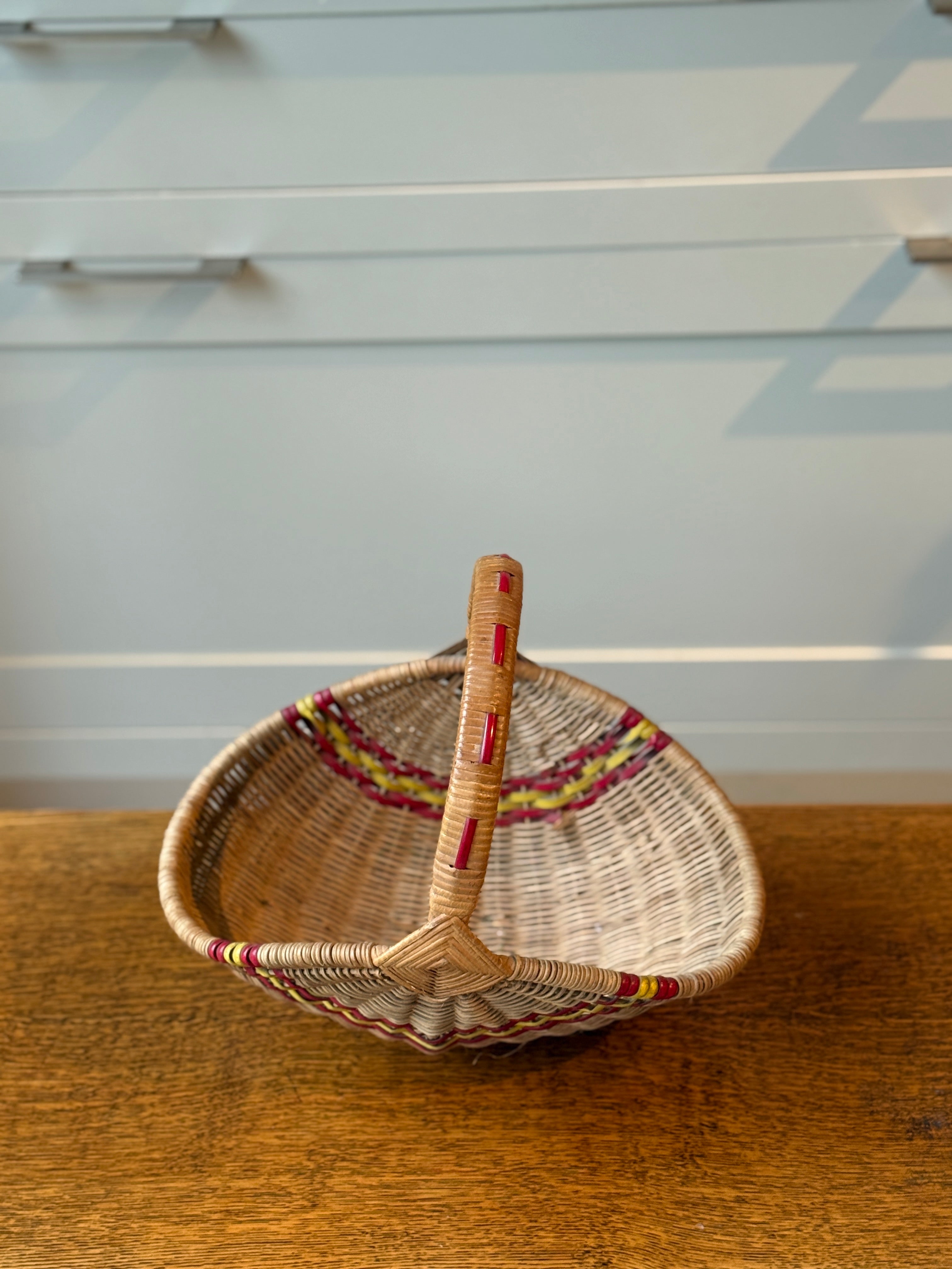 Small Decorative Basket with Red and Yellow Accents