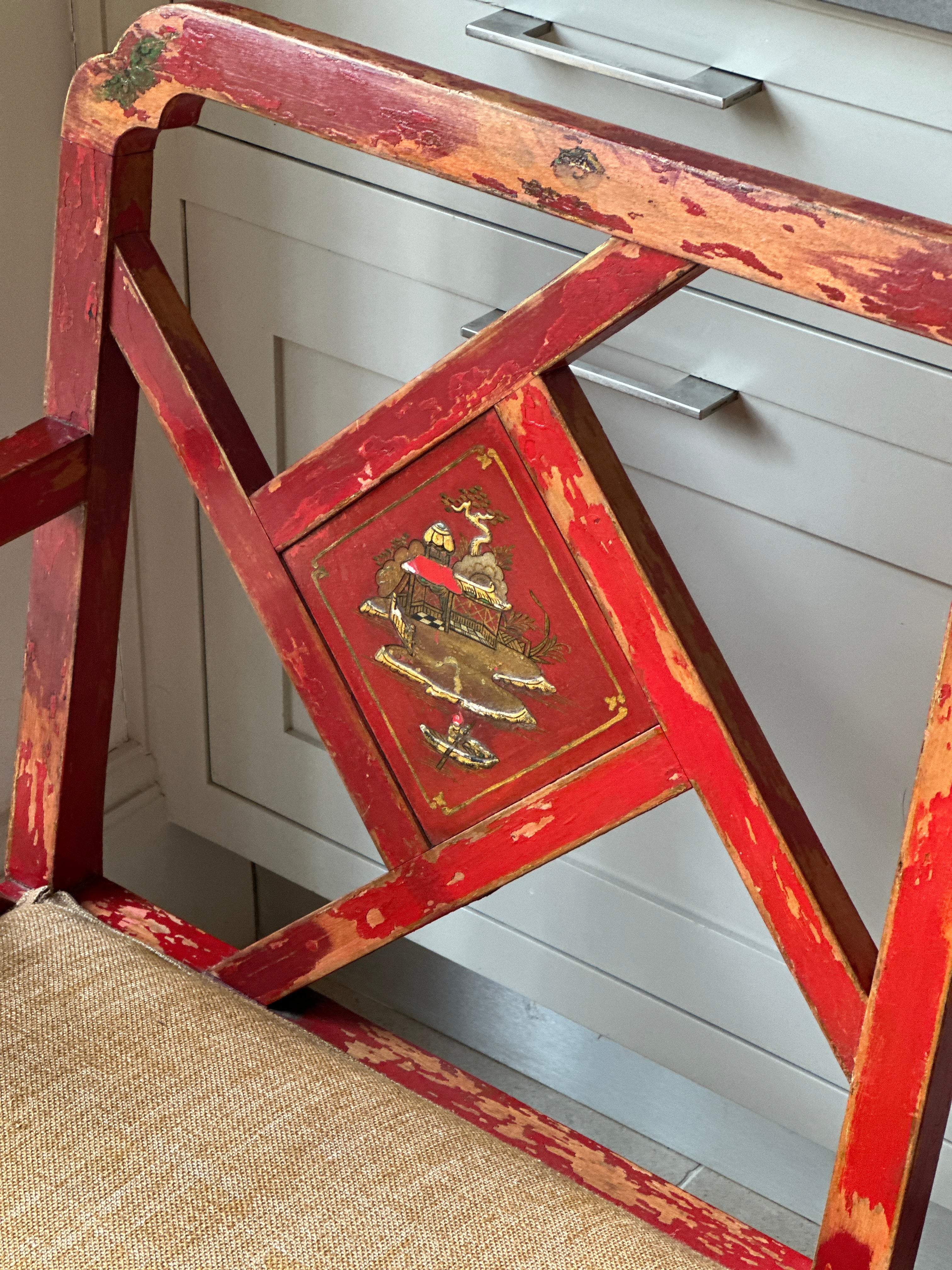 Charming Red Chinoiserie Sofa/Bench with well worn decorative paintwork.