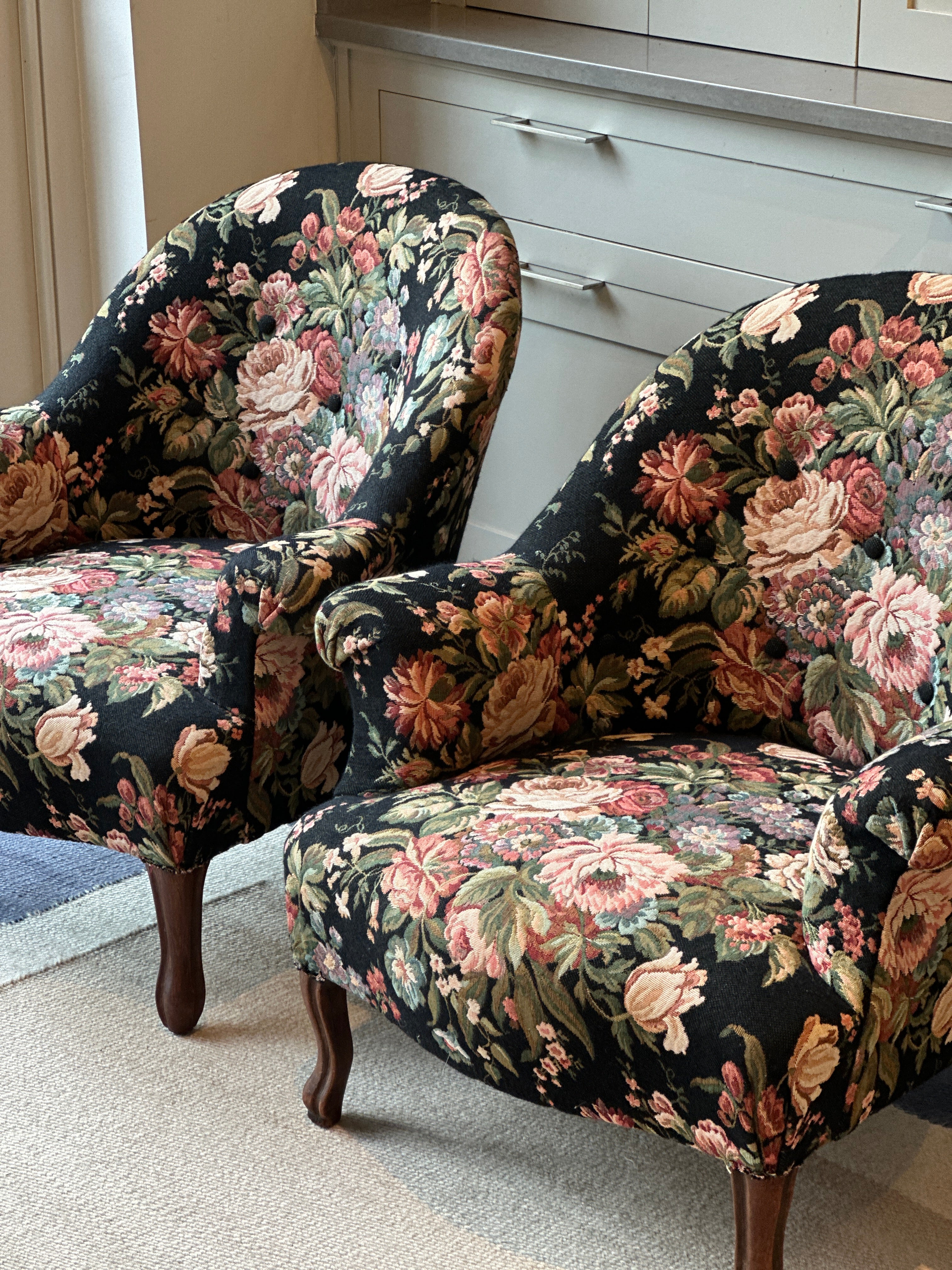 Pair of French Tub Chairs with original black floral tapestry fabric.