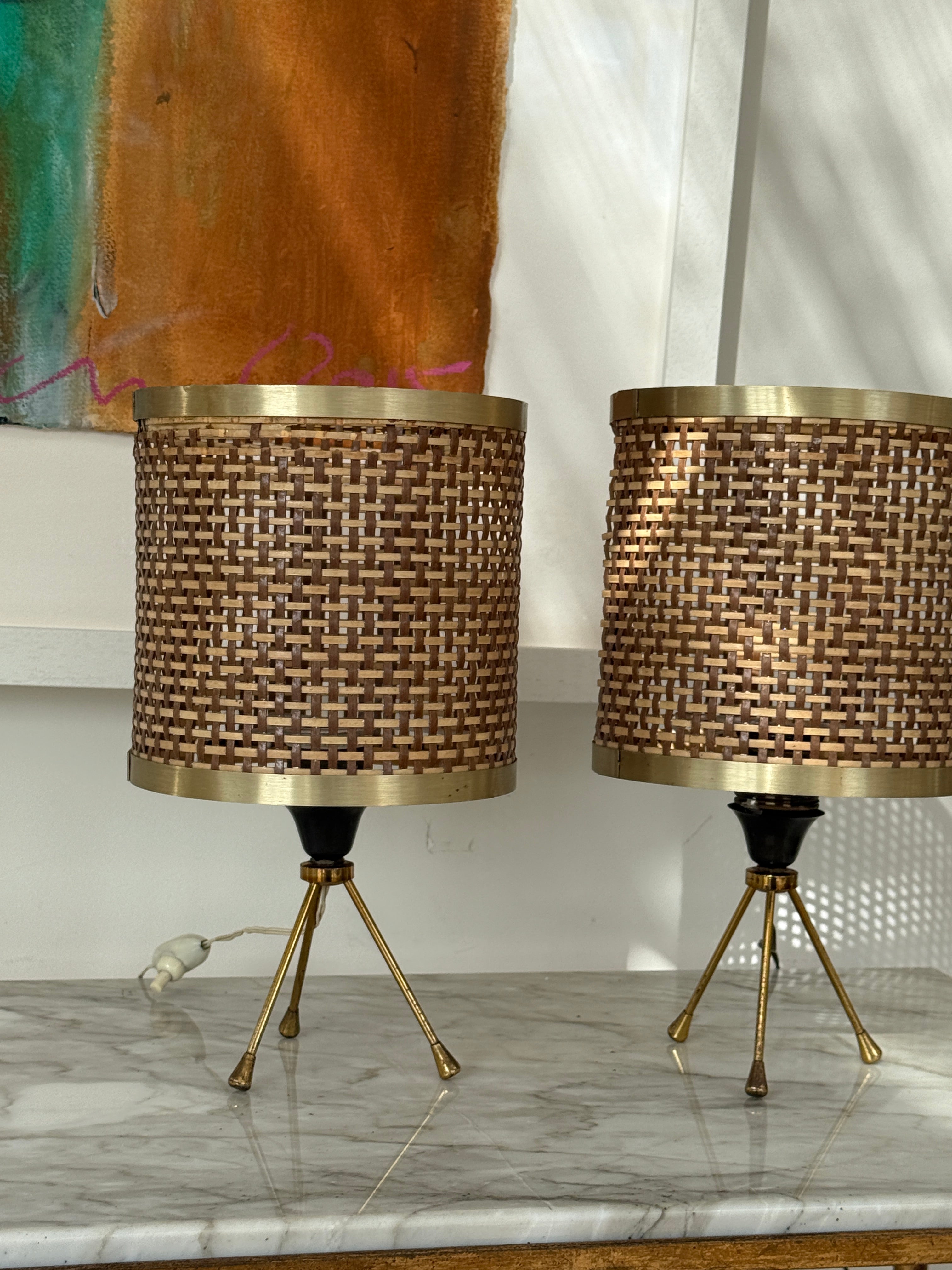 Pair of Rattan and Brass Tripod Taboe Lamps .