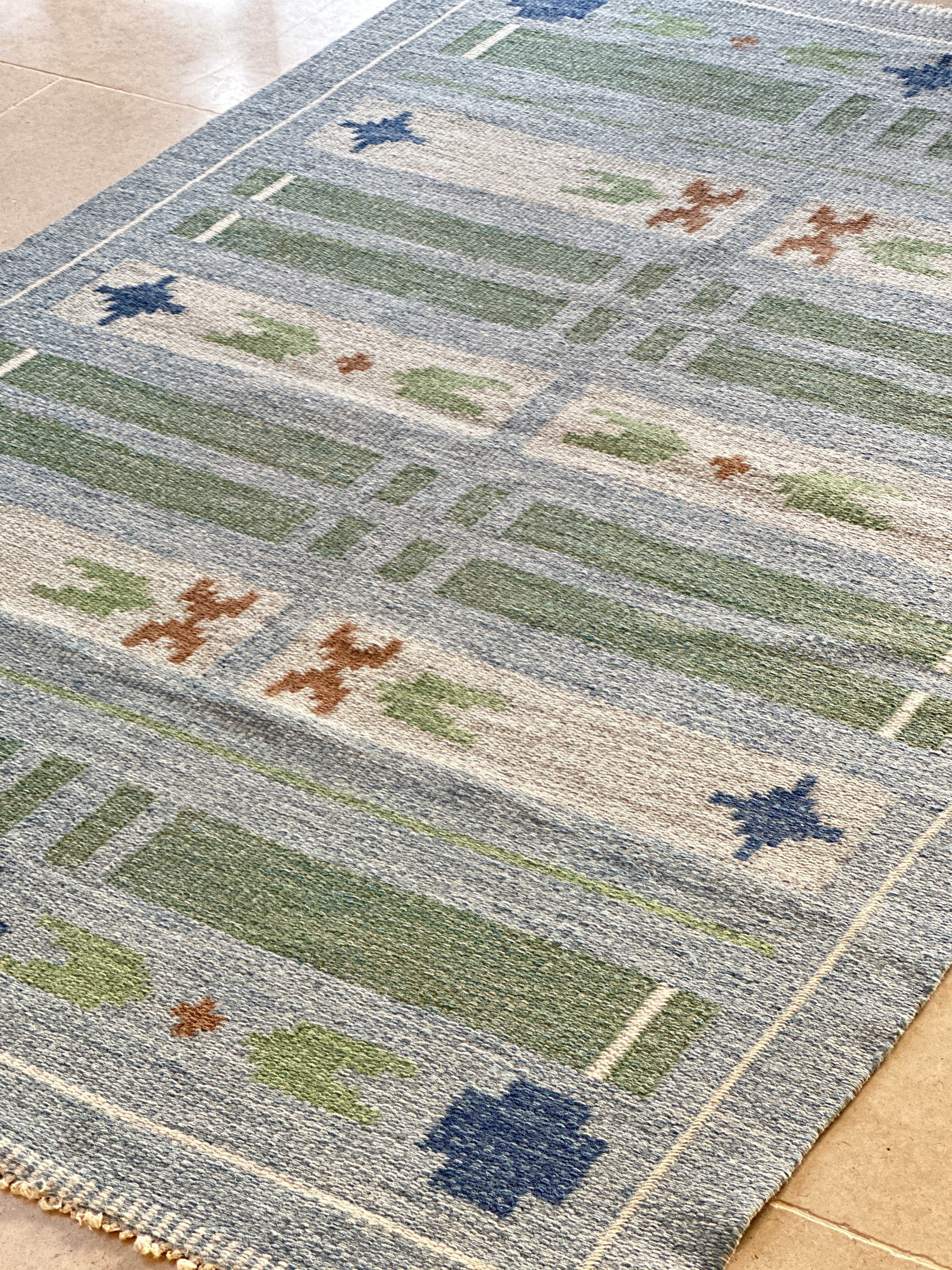 Swedish vintage kilim in blues and greens.