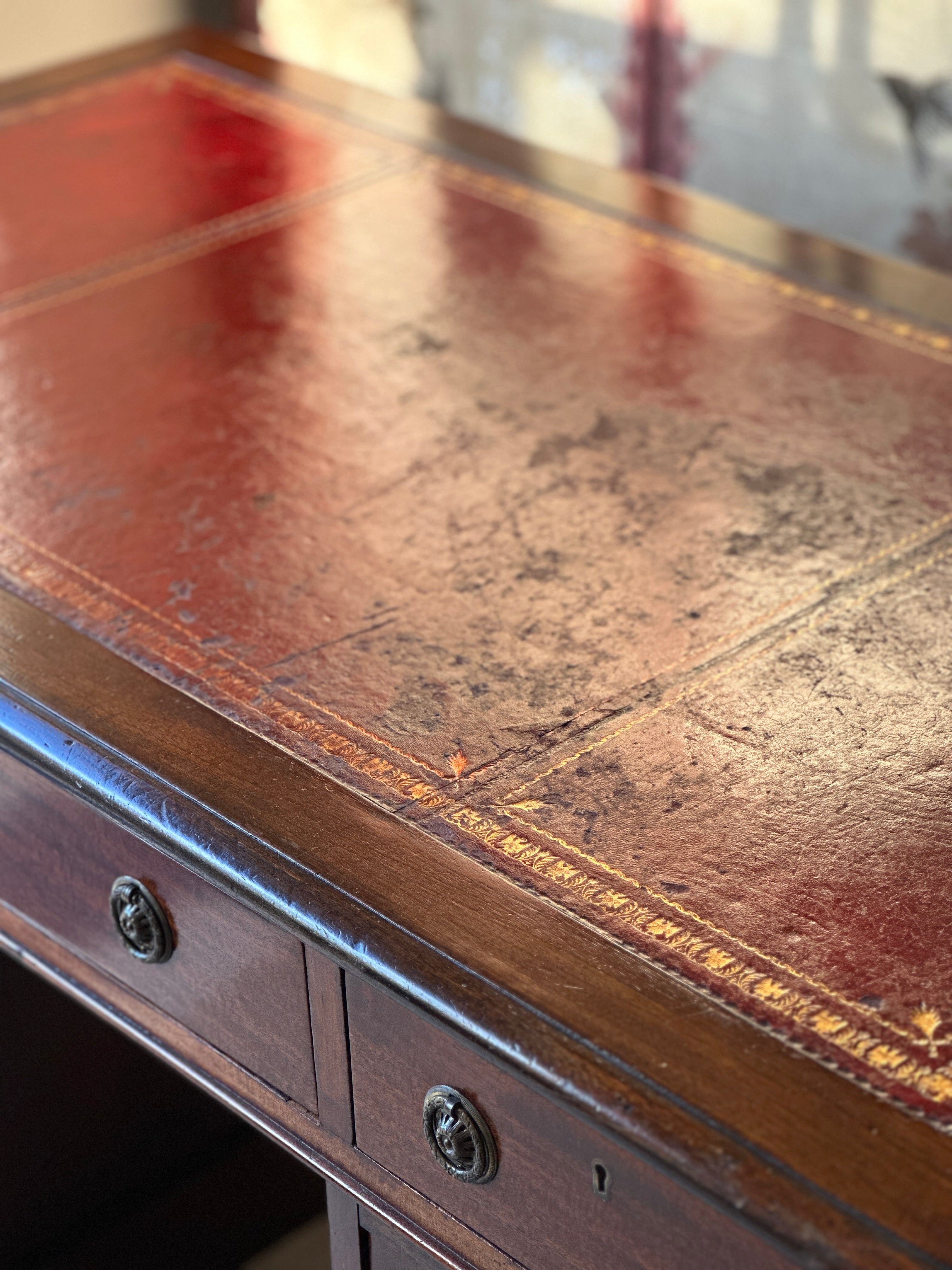 Amazing 19th Century Mahogany Desk with well worn Red Leather Top