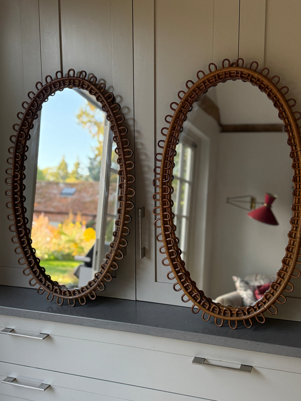 Pair of Large Oval Albini Mirrors
