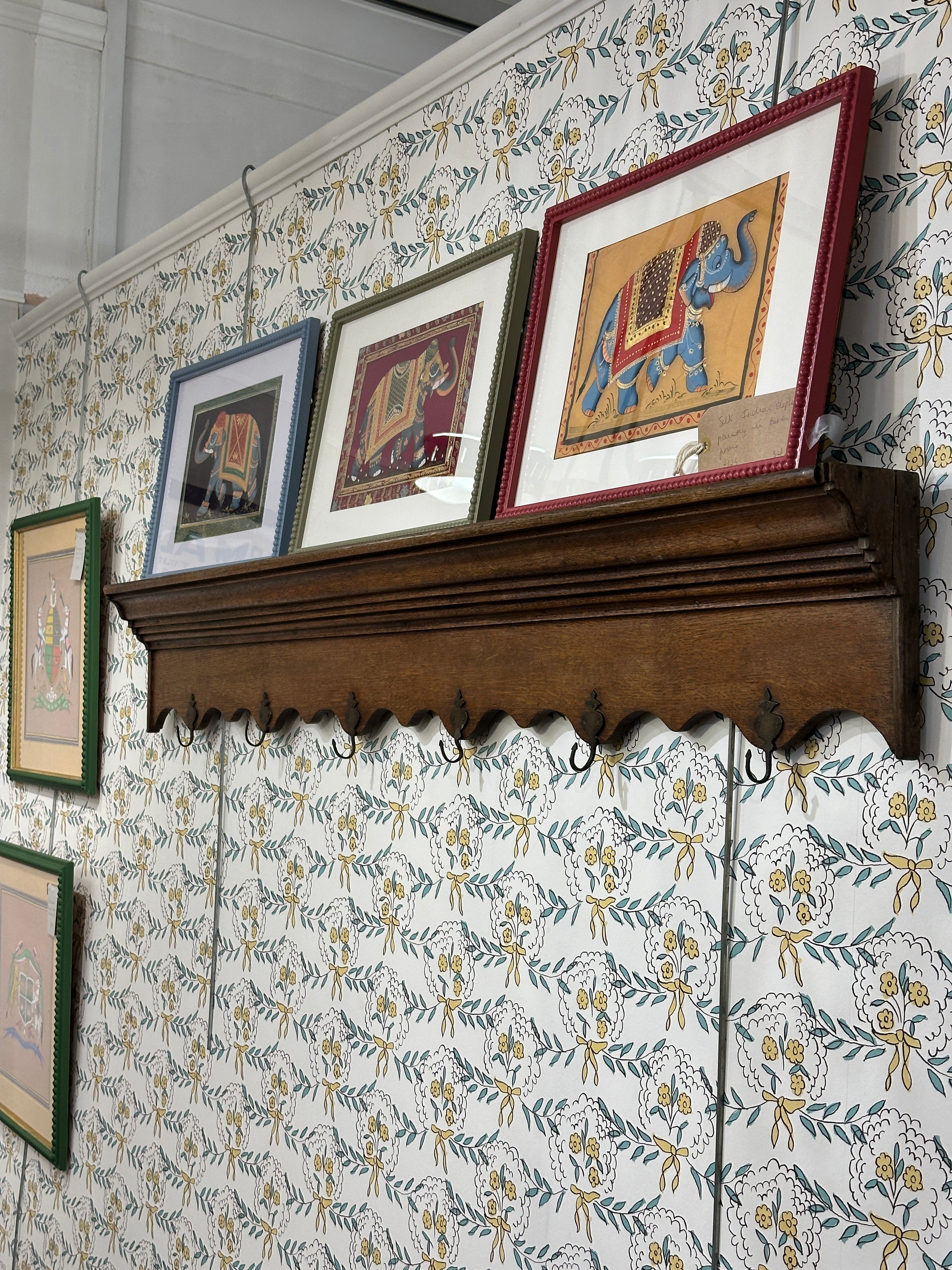 A Long French Oak Shelf with 6 metal coat hooks.