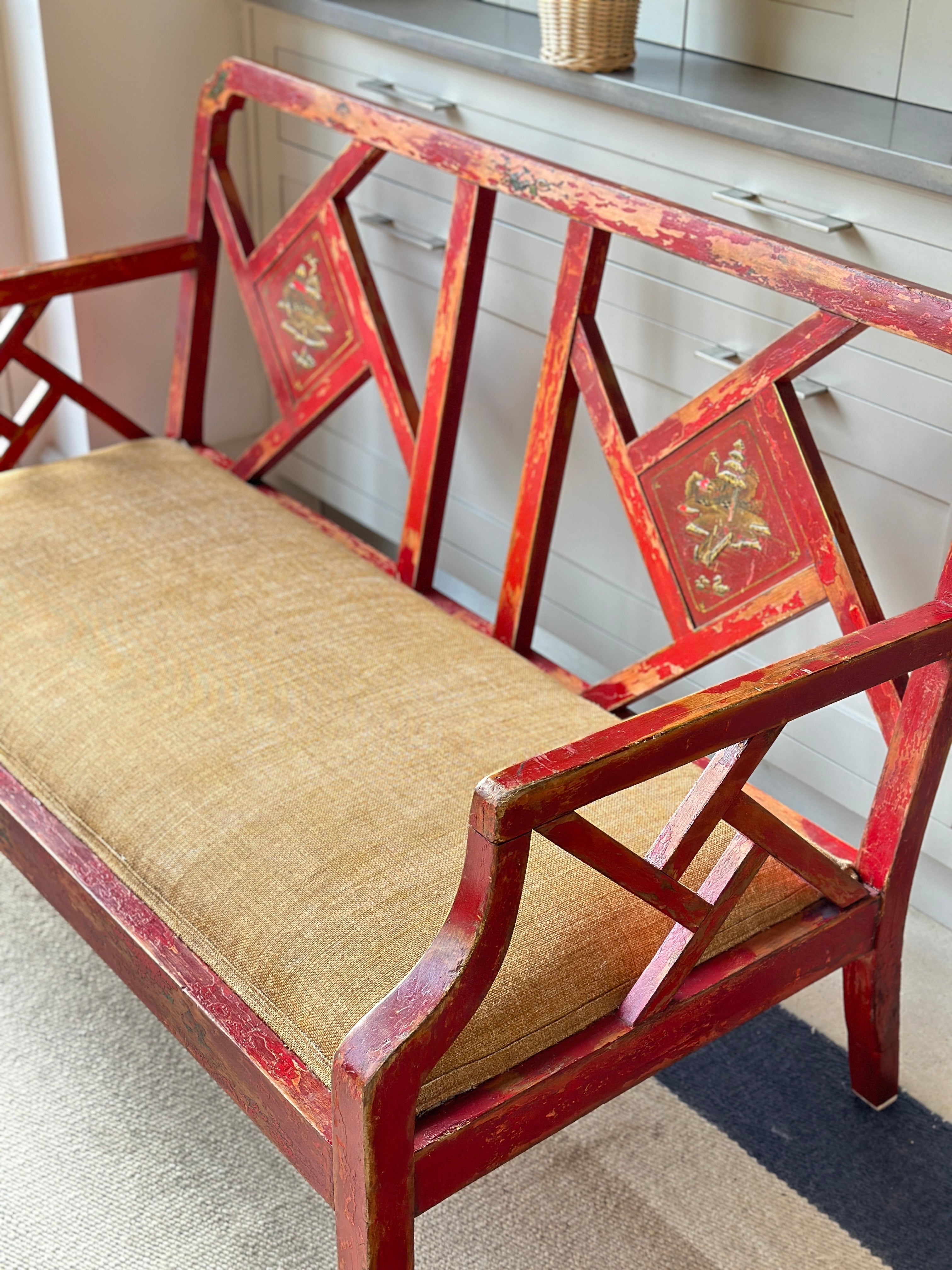 Charming Red Chinoiserie Sofa/Bench with well worn decorative paintwork.