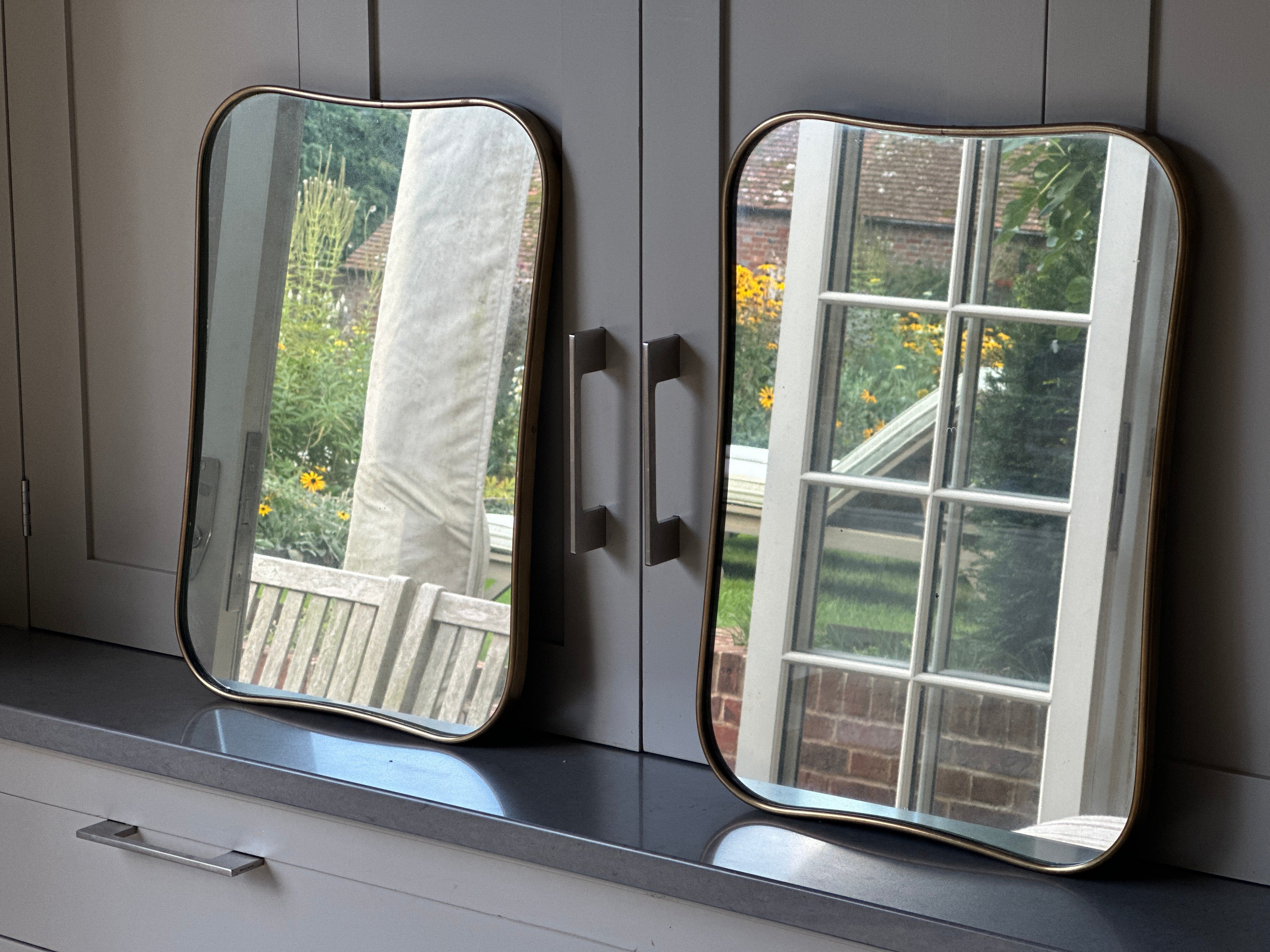 Matching Pair of Small Italian 1950s Brass Shield Mirrors