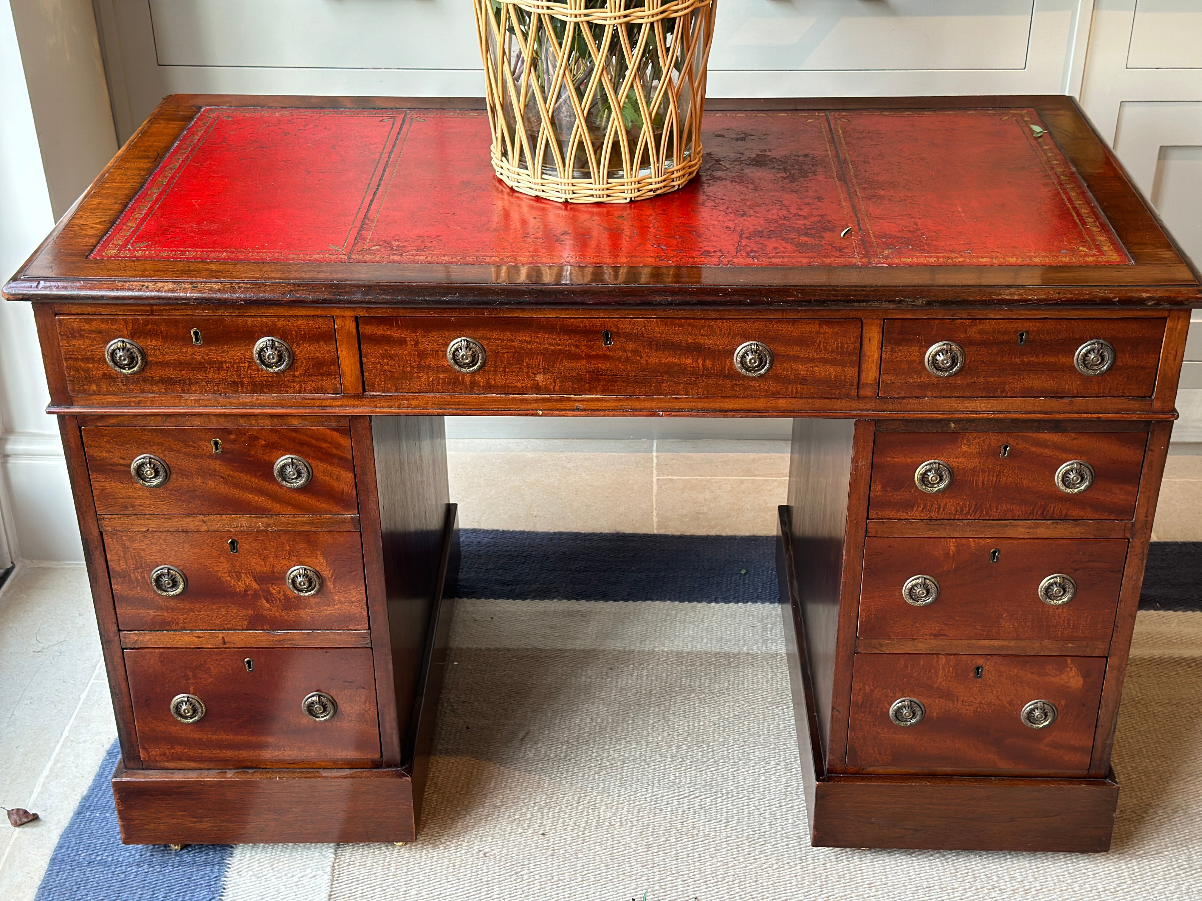 Amazing 19th Century Mahogany Desk with well worn Red Leather Top