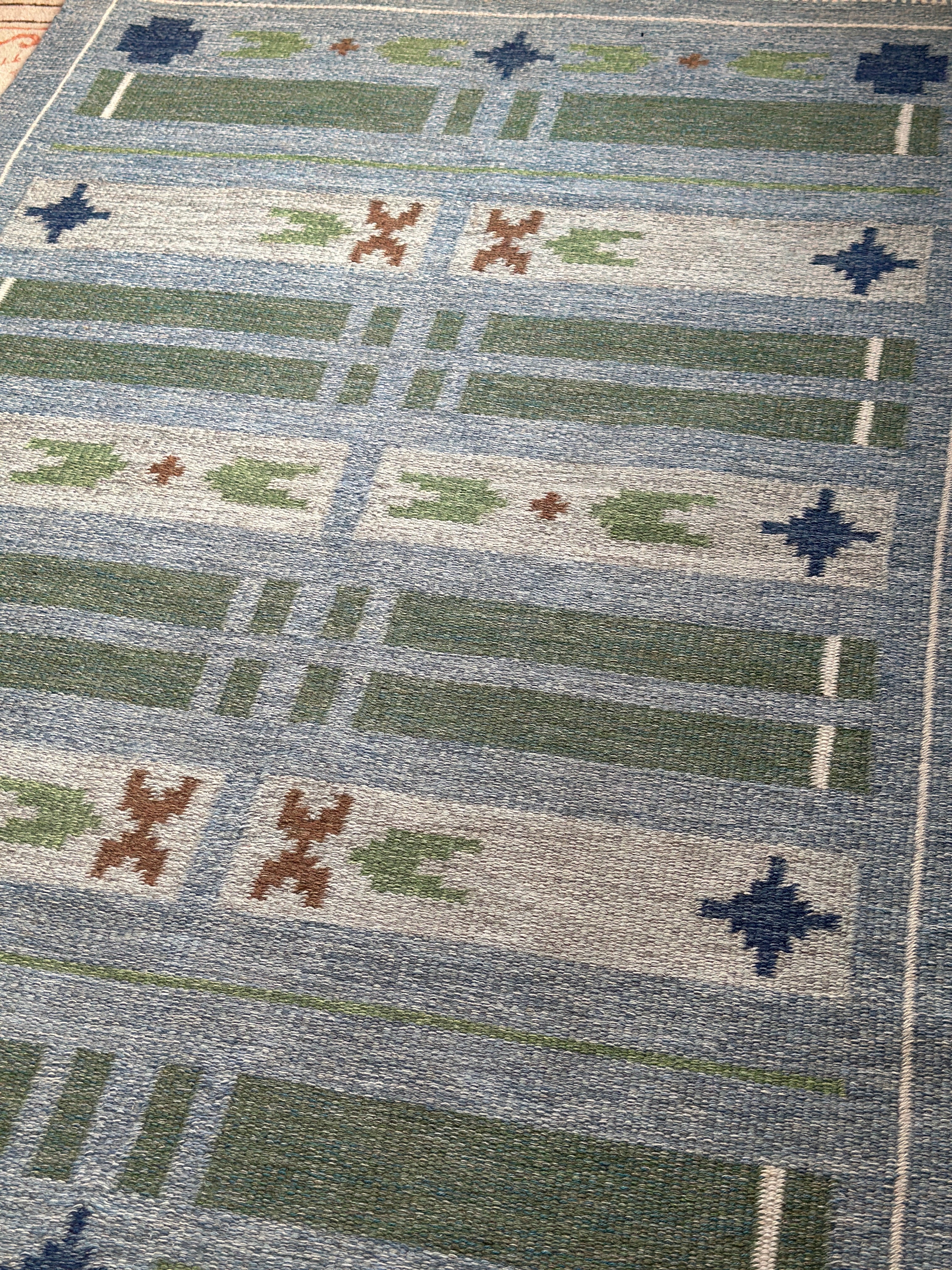 Swedish vintage kilim in blues and greens.