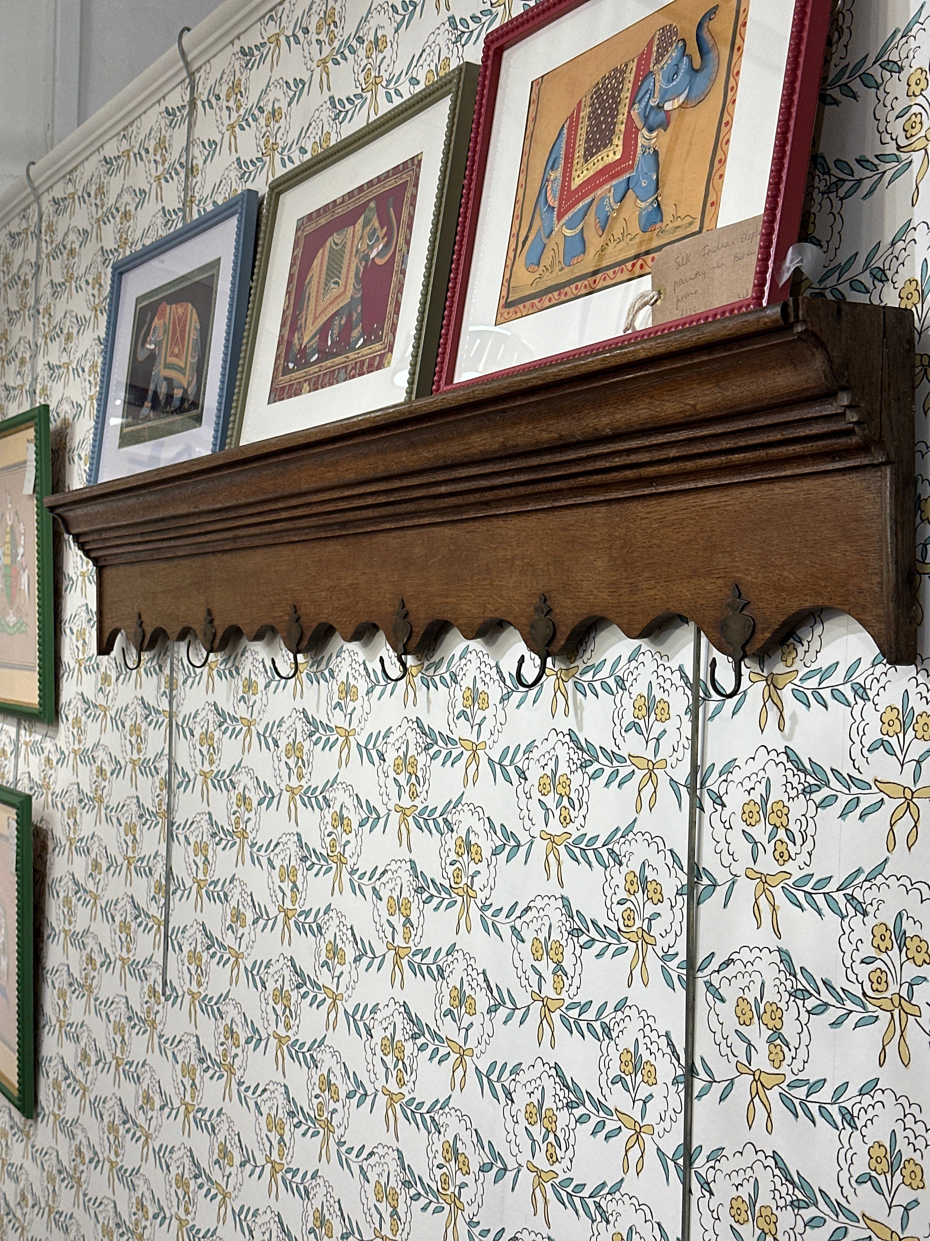 A Long French Oak Shelf with 6 metal coat hooks.