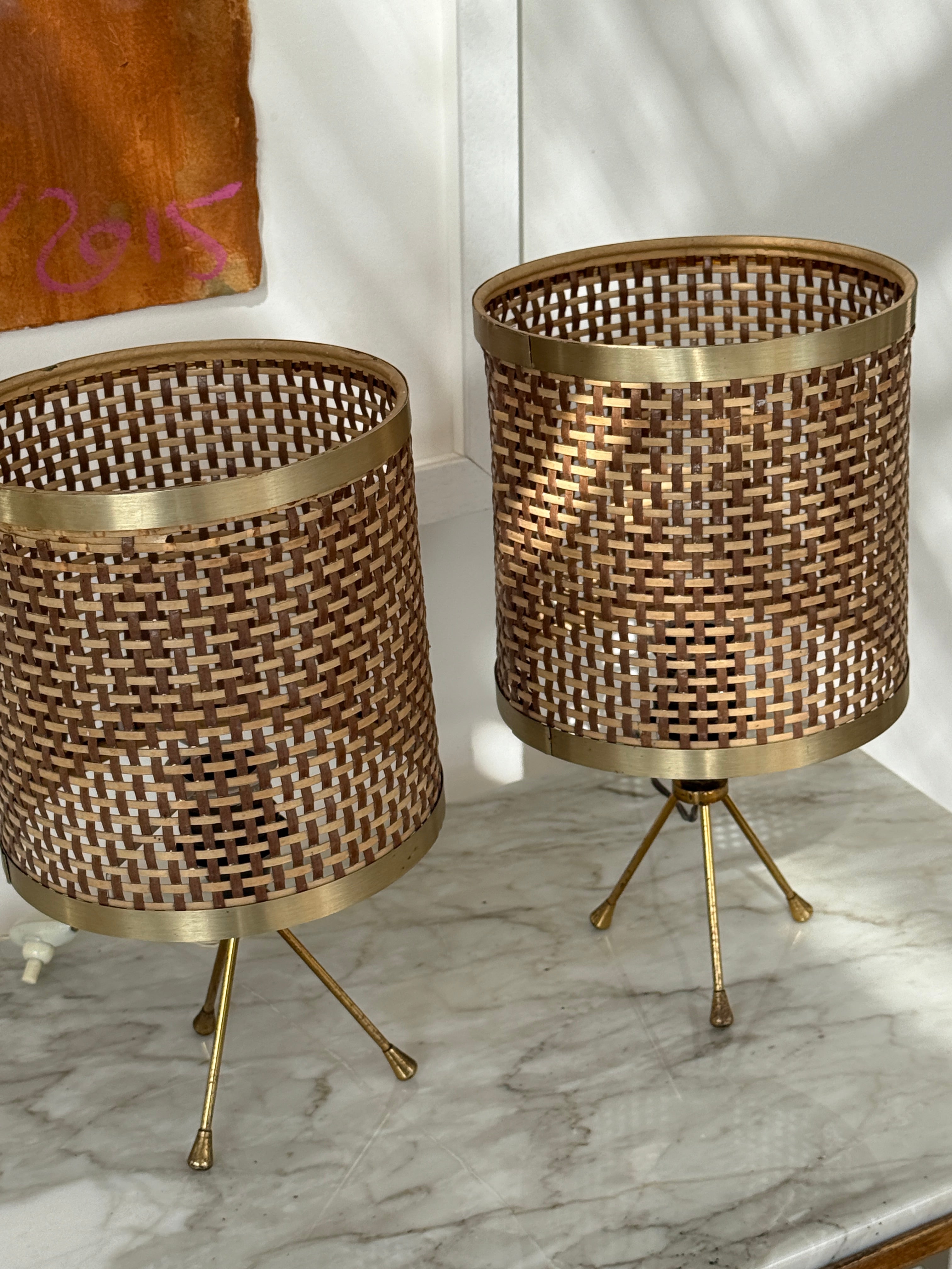 Pair of Rattan and Brass Tripod Taboe Lamps .