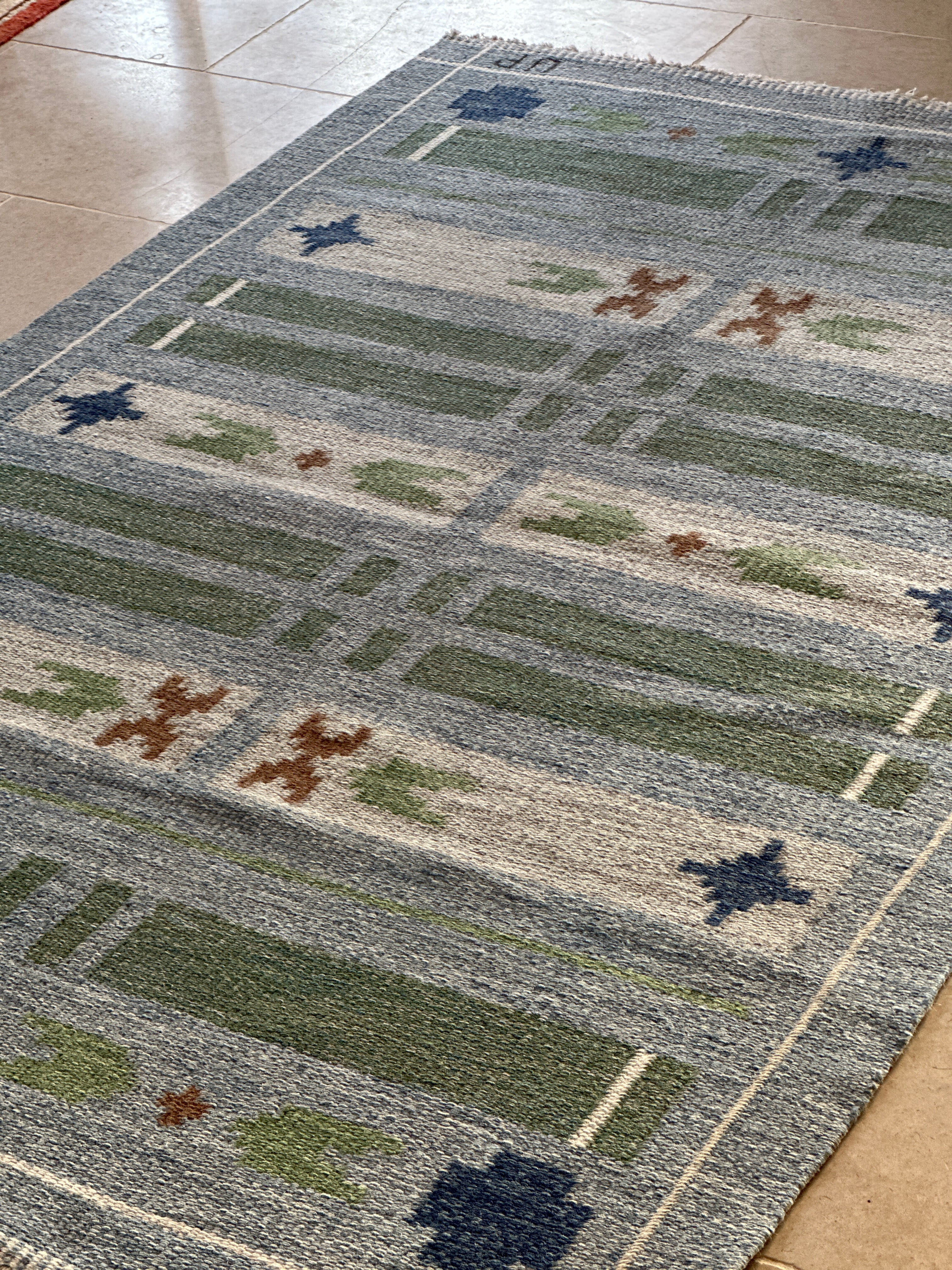 Swedish vintage kilim in blues and greens.