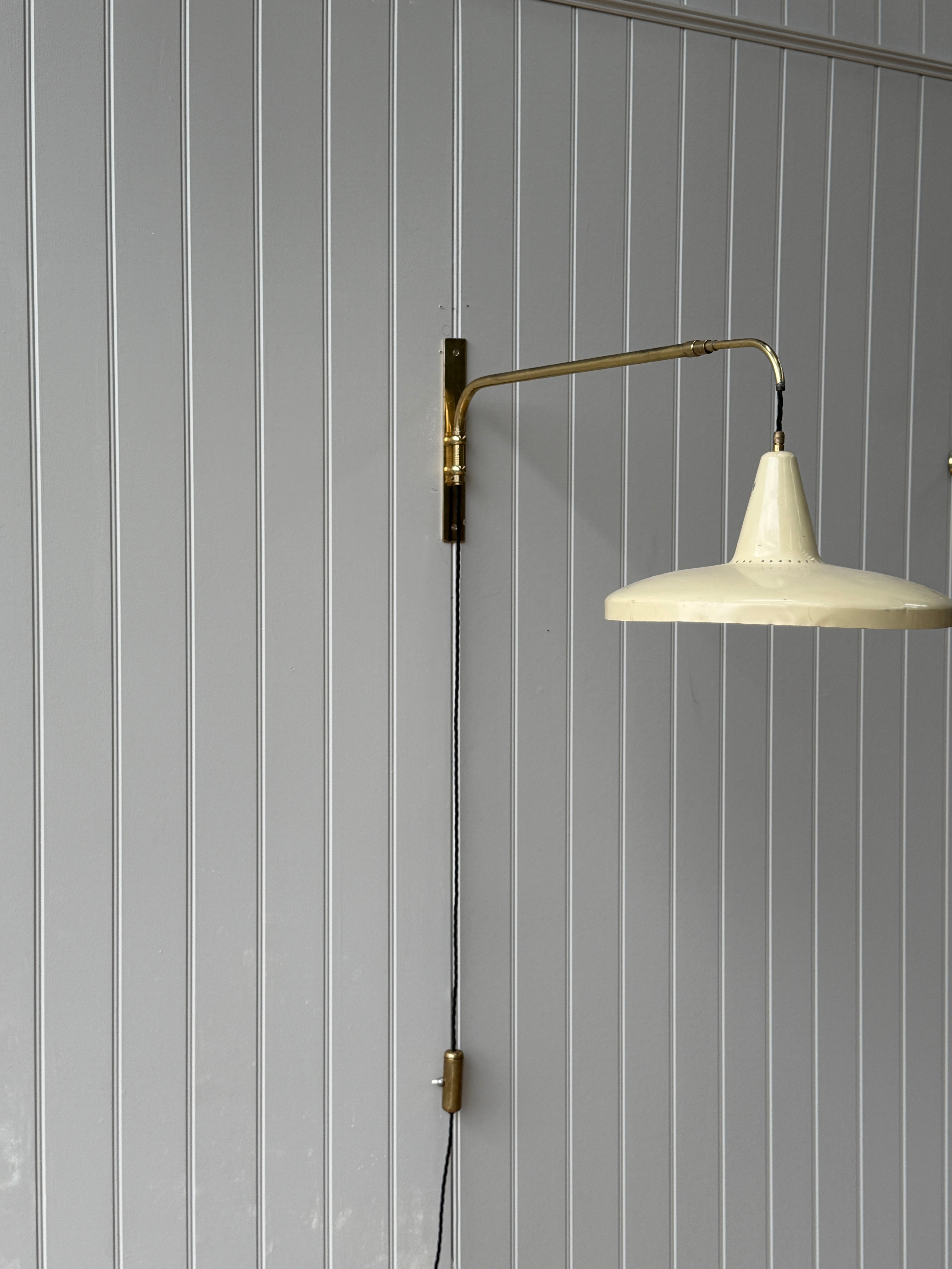Italian 1950s Extending Brass Wall light with Yellow Toleware shade.