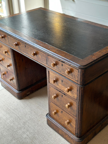 Antique Oak Desk with leather top on castors