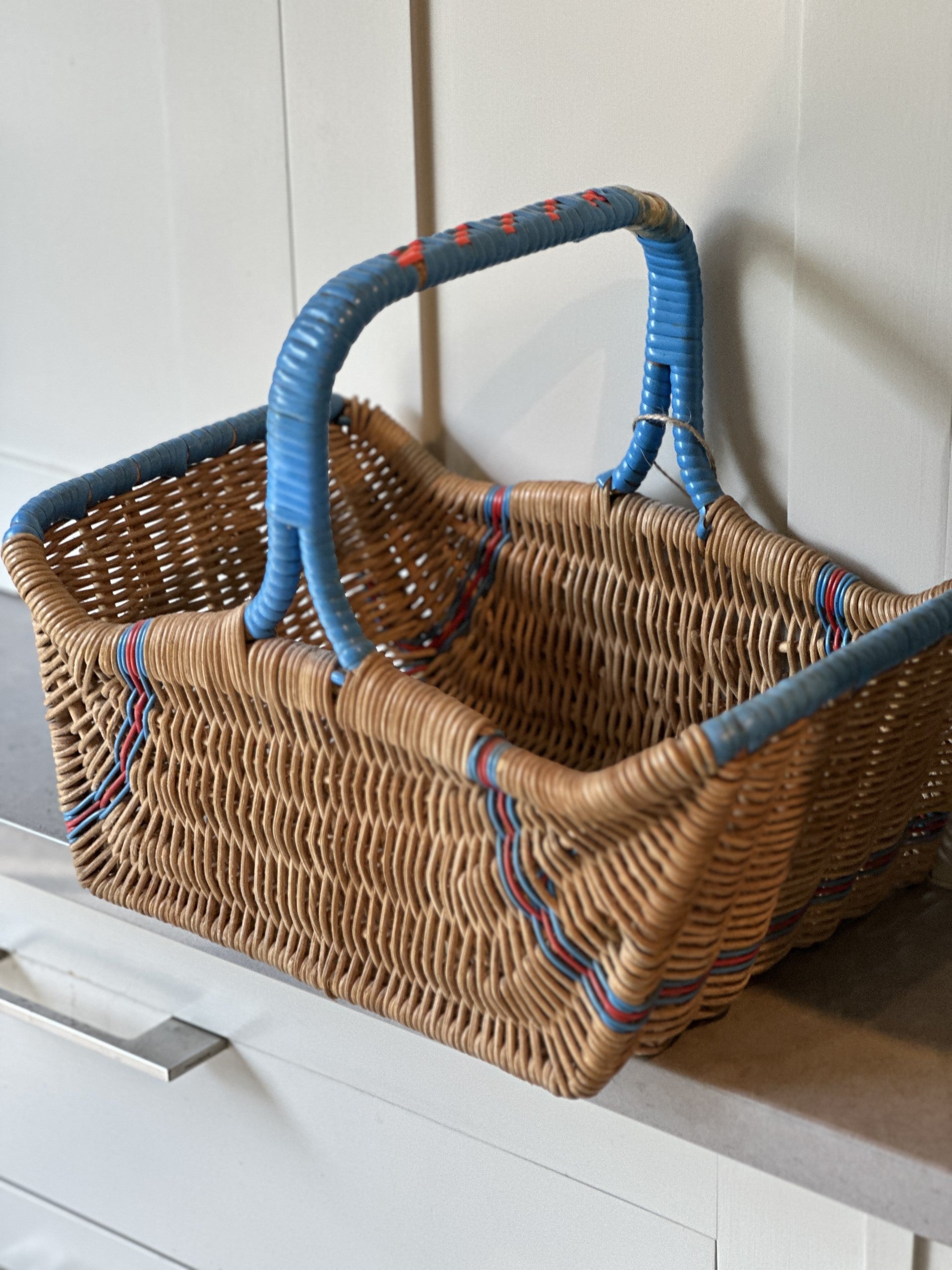 Vintage Wicker Basket with Blue and Red Accents