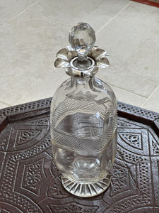 Beautiful cut glass decanter with silver floret top with stopper