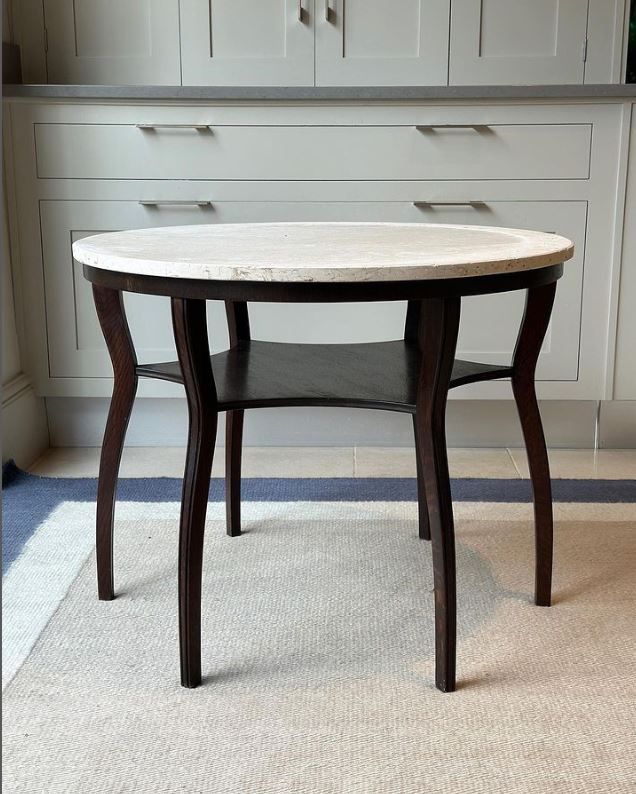 Oak Table with Limestone Top. Nice stretcher shelf in star shape.