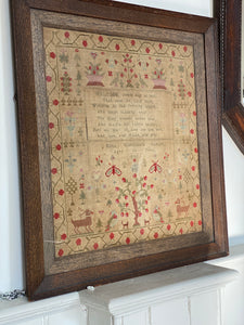 A framed George IV needlework sampler