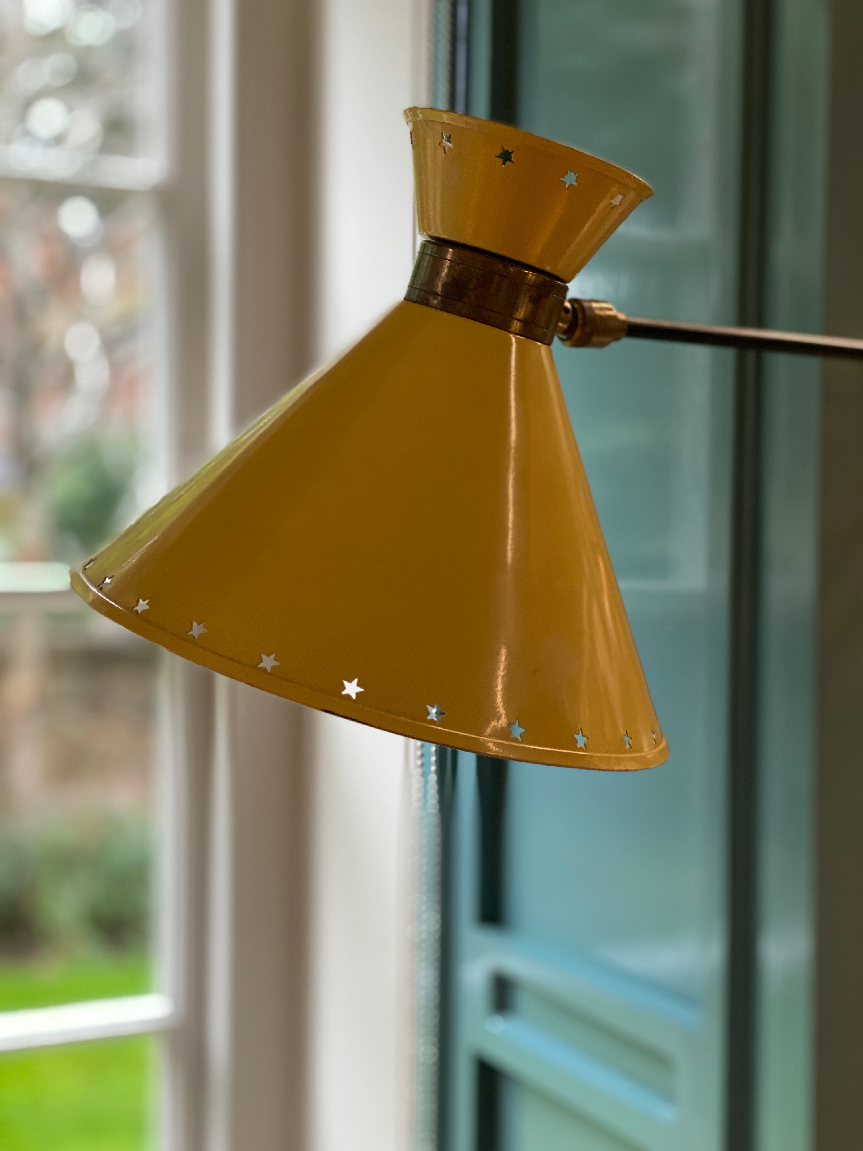 Mustard yellow Rene Mathieu Diabolo Wall light