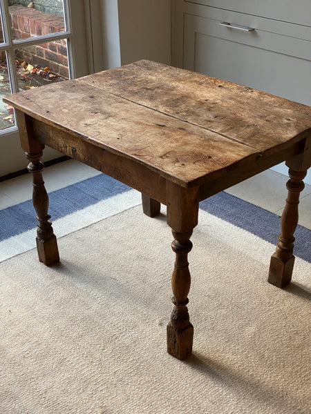 A very rustic oak side table